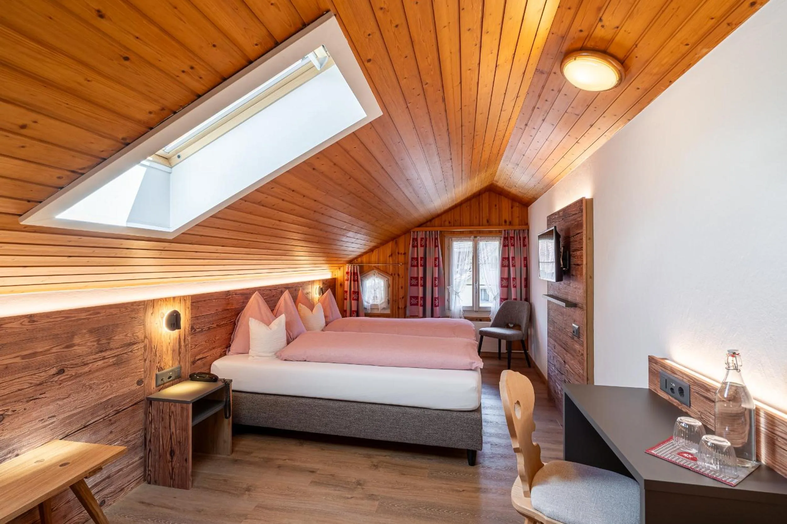 Photo of the whole room, Bed in Alpenblick Hotel & Restaurant Wilderswil by Interlaken