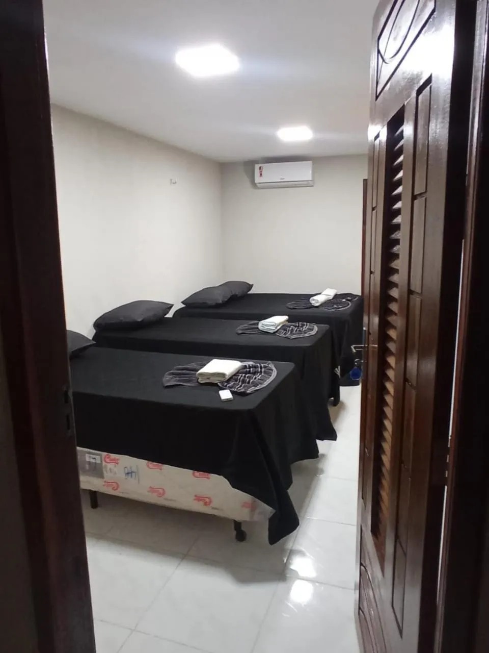 Bed in Pousada Recanto Beach