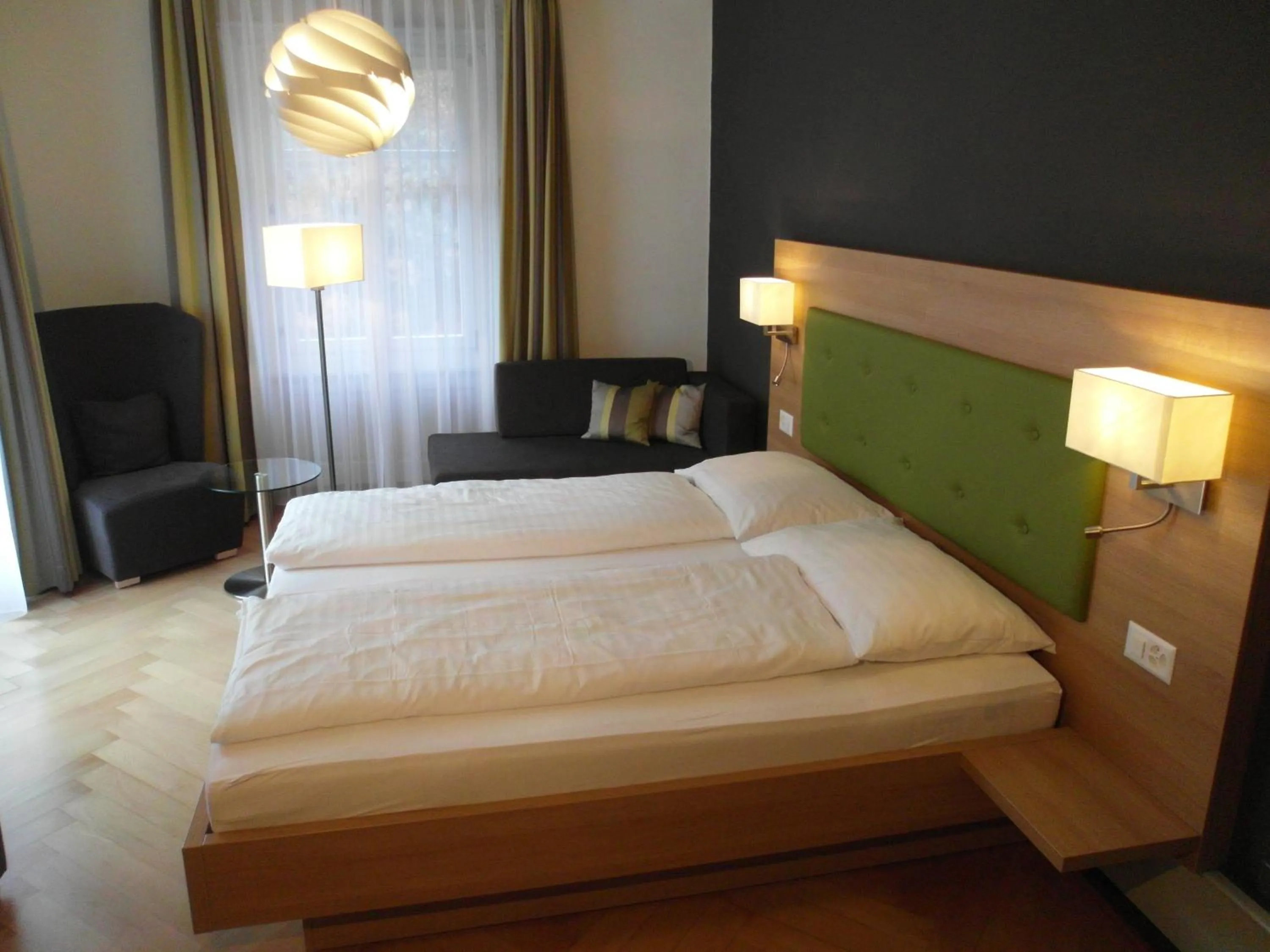 Photo of the whole room, Bed in Waldhotel Unspunnen