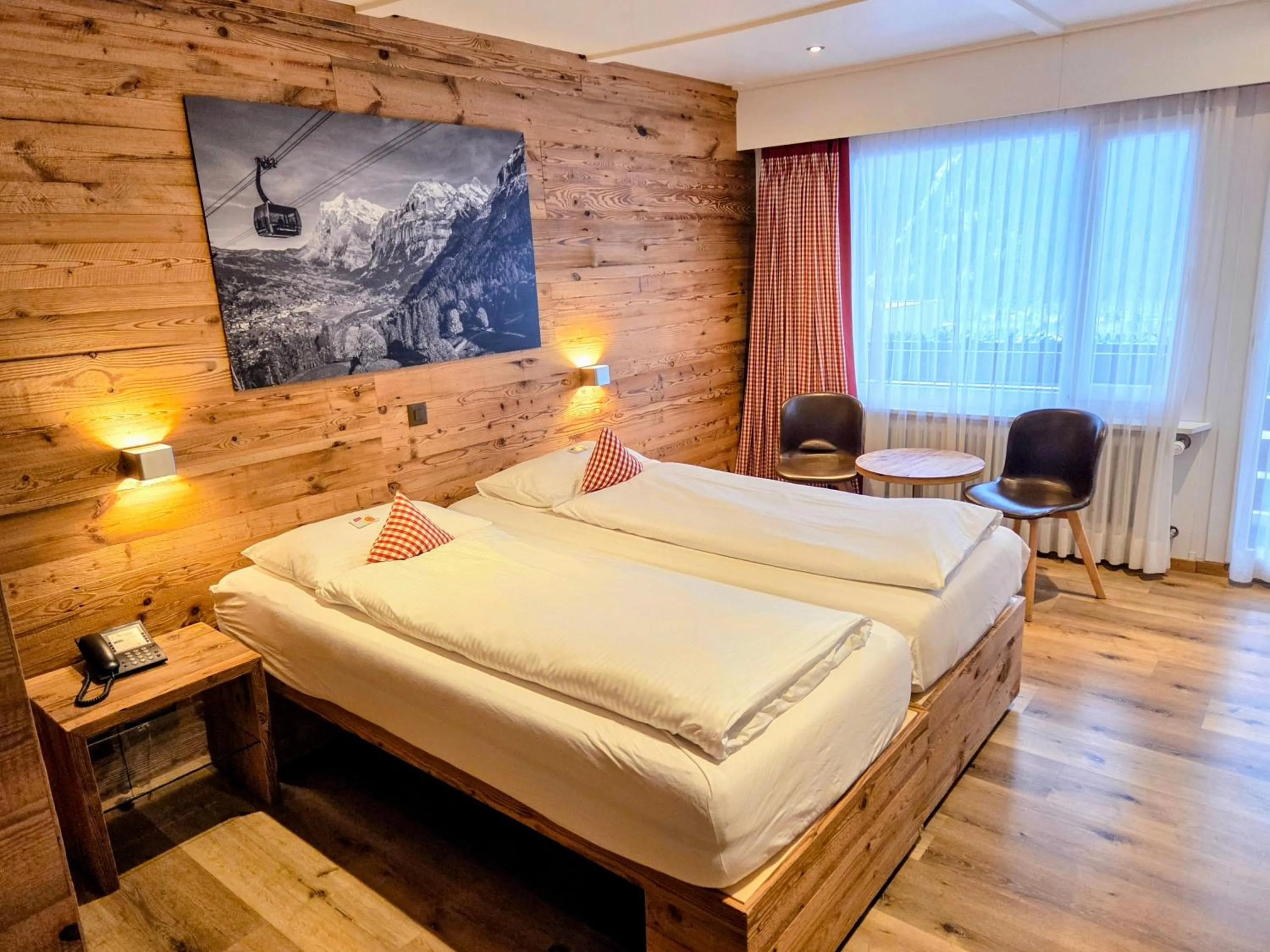 Photo of the whole room, Bed in Hotel Bernerhof Grindelwald