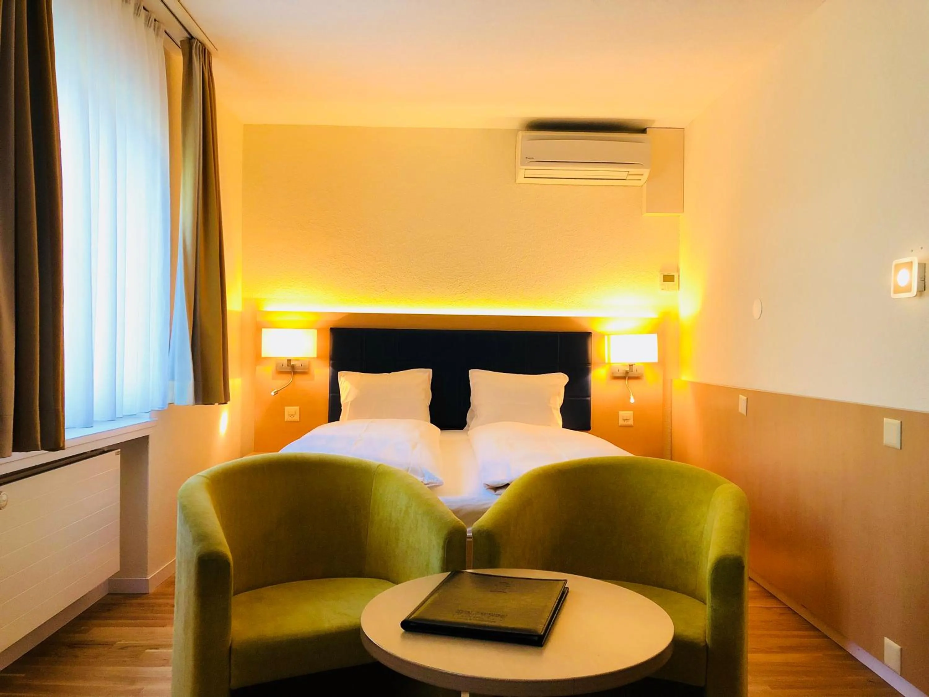 Seating area, Bed in Hotel Felmis