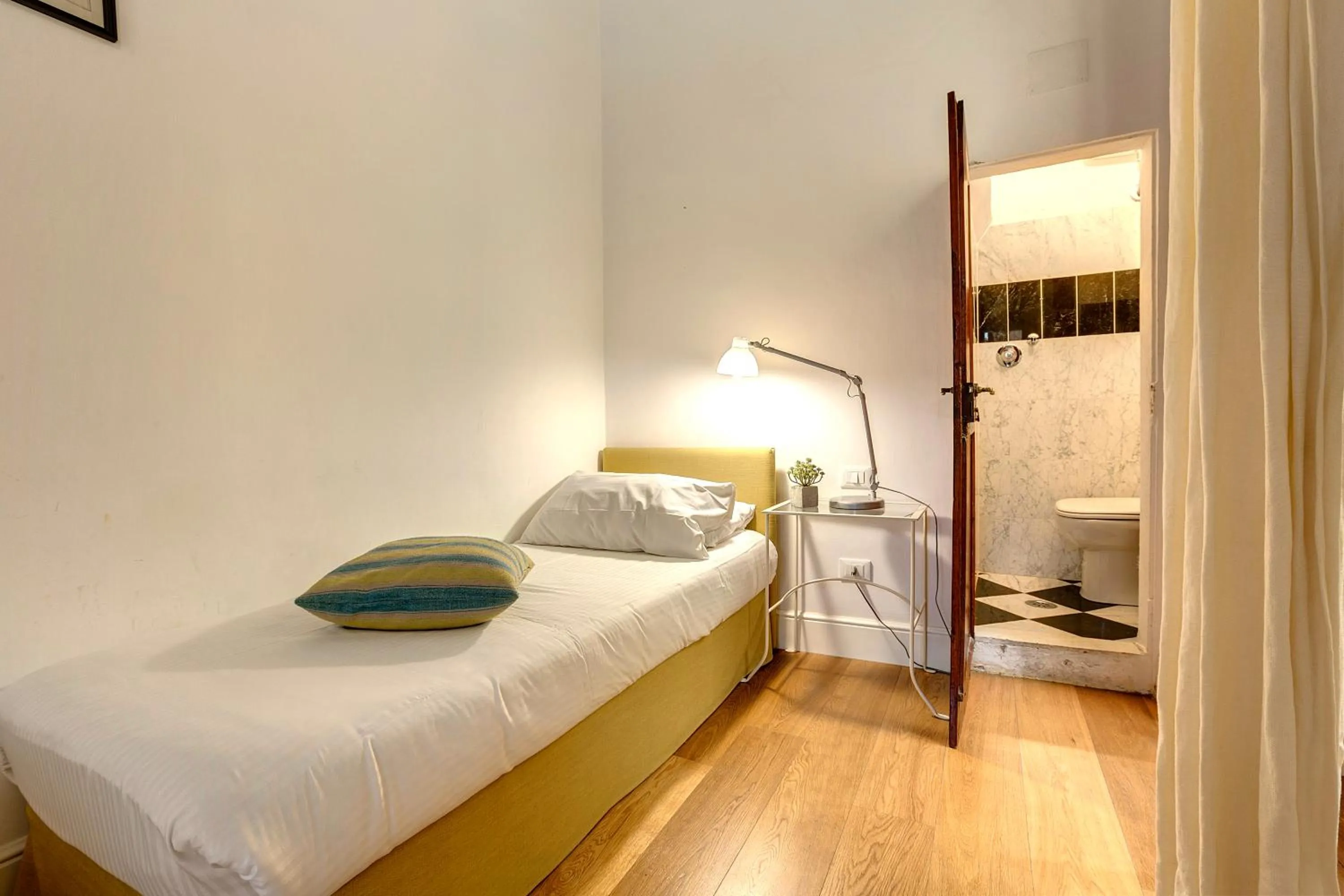 Bedroom, Bed in Tegolaio Apartment by Mamo Florence