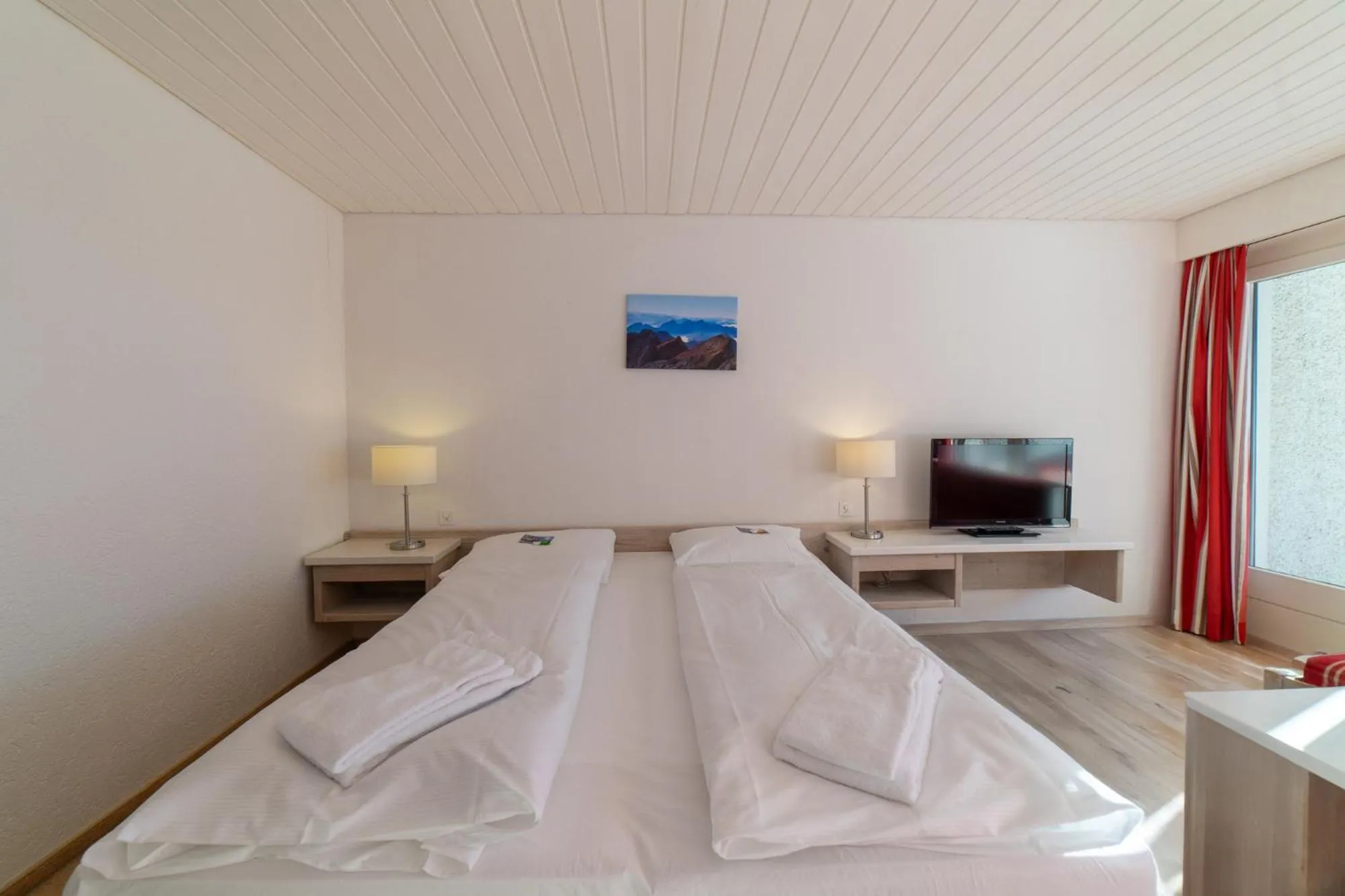 Bed in Hotel Säntis Lodge