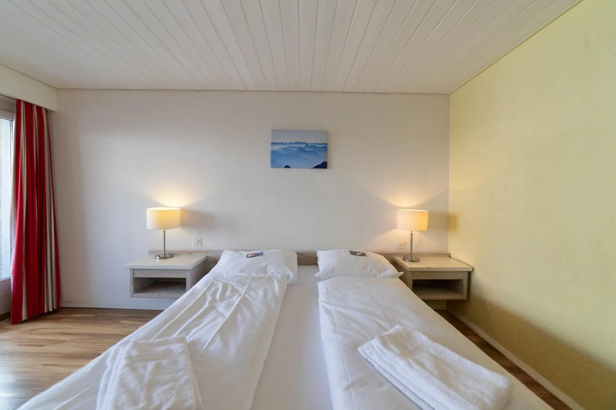 Bed in Hotel Säntis Lodge