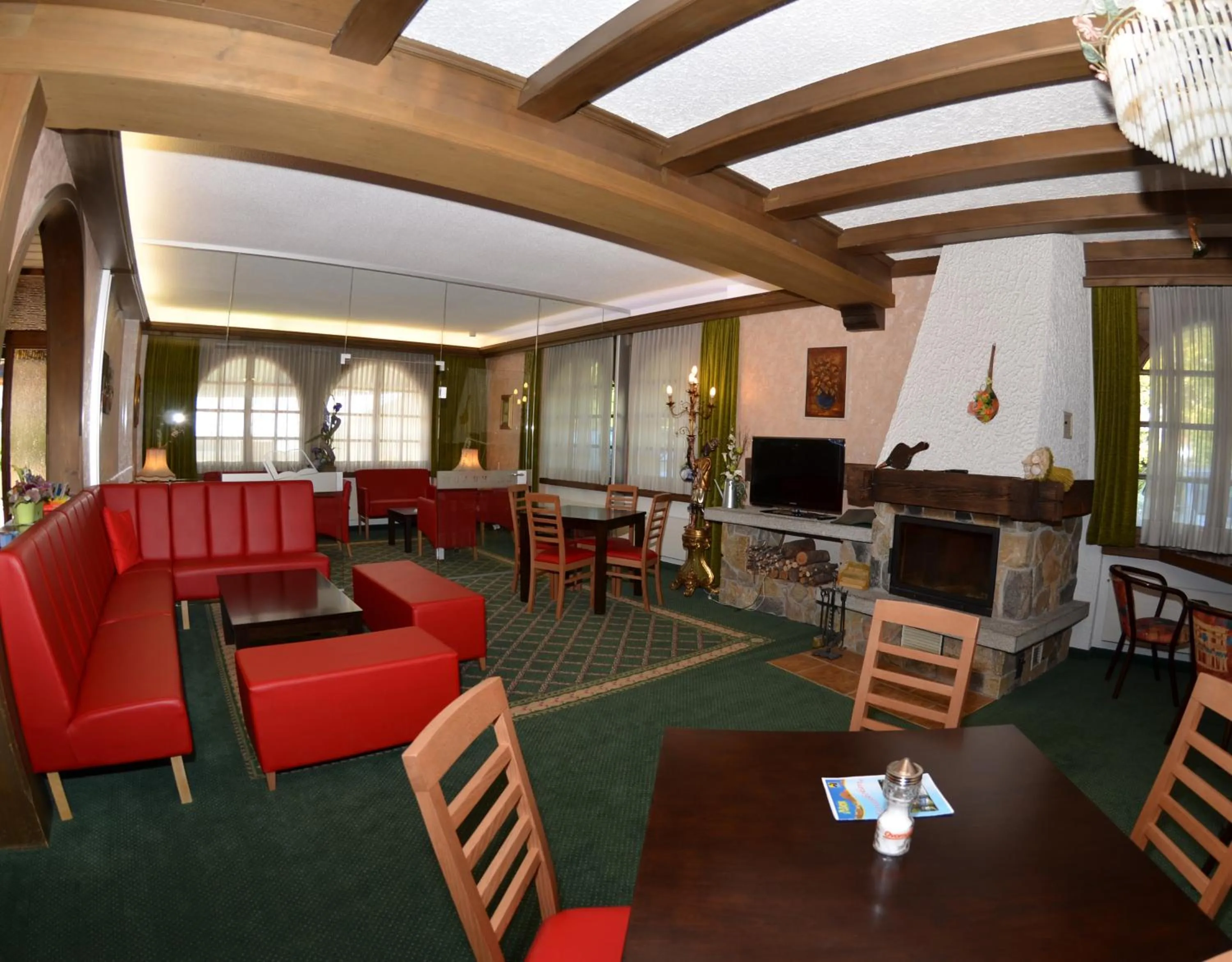 Communal lounge/ TV room in Hotel Alex