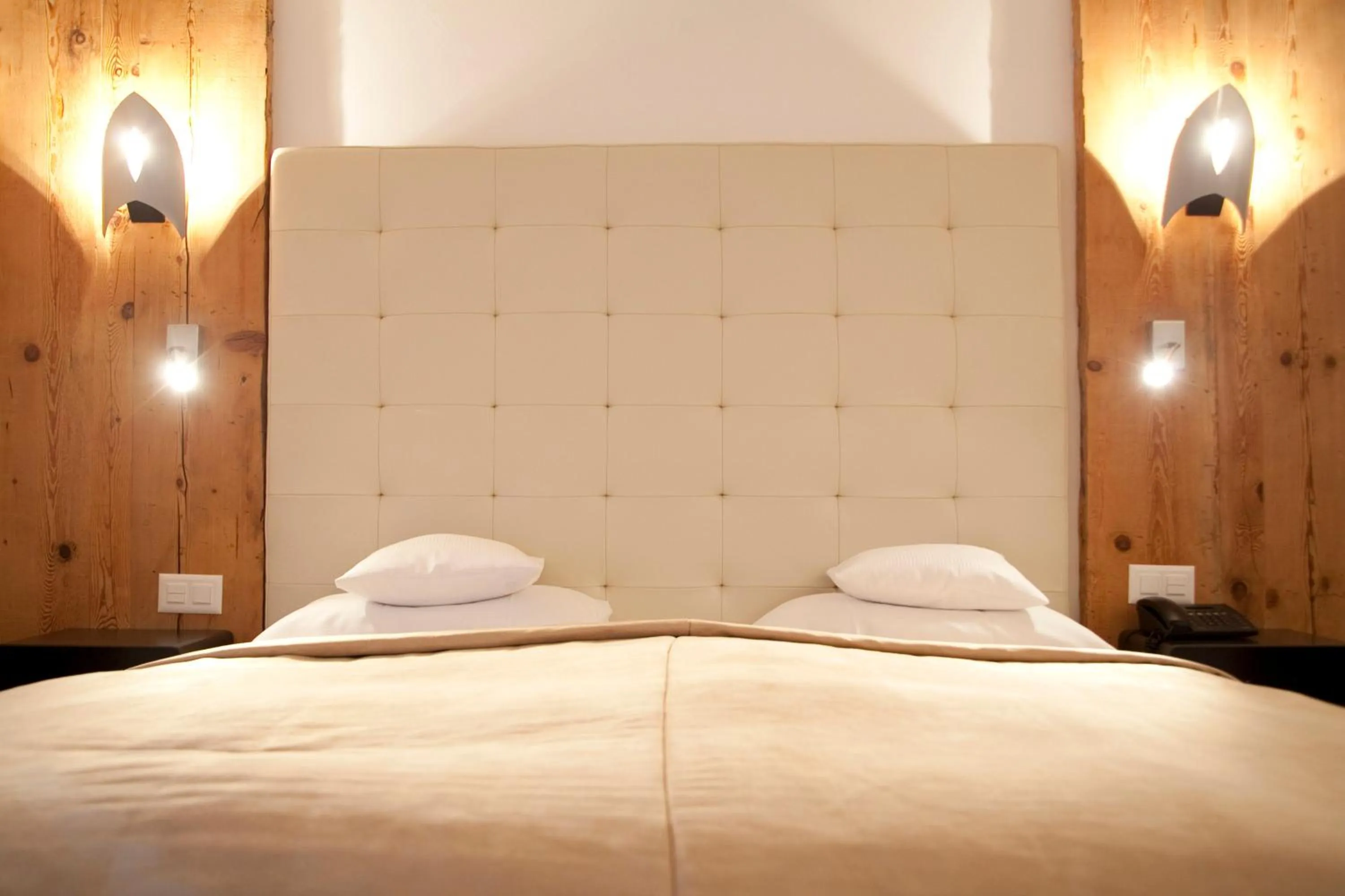 Bed in Le Mirabeau Resort & Spa