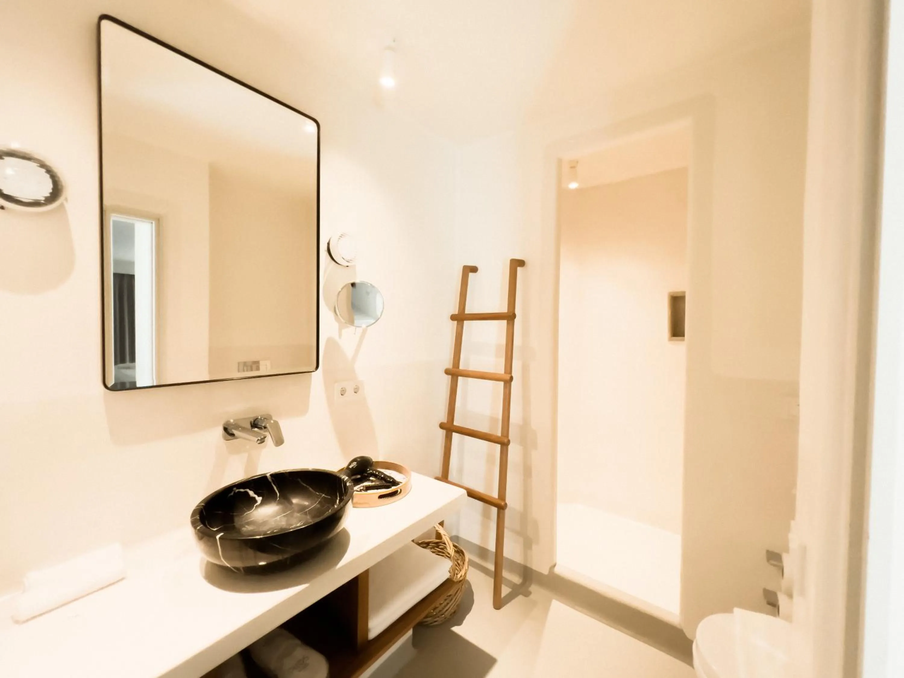 Toilet, Bed in Pilos Suites