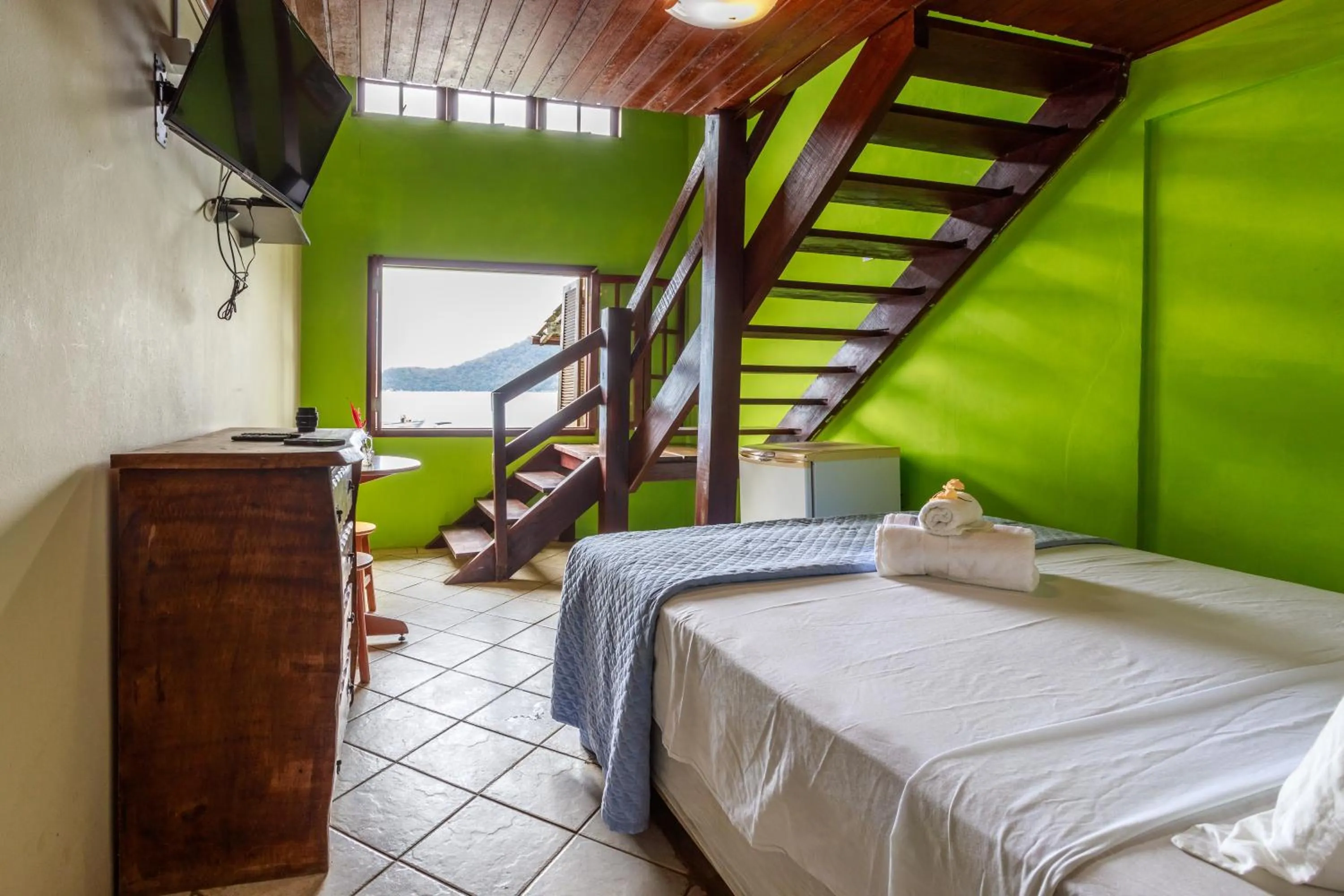 Bed in Pousada Cruzoé