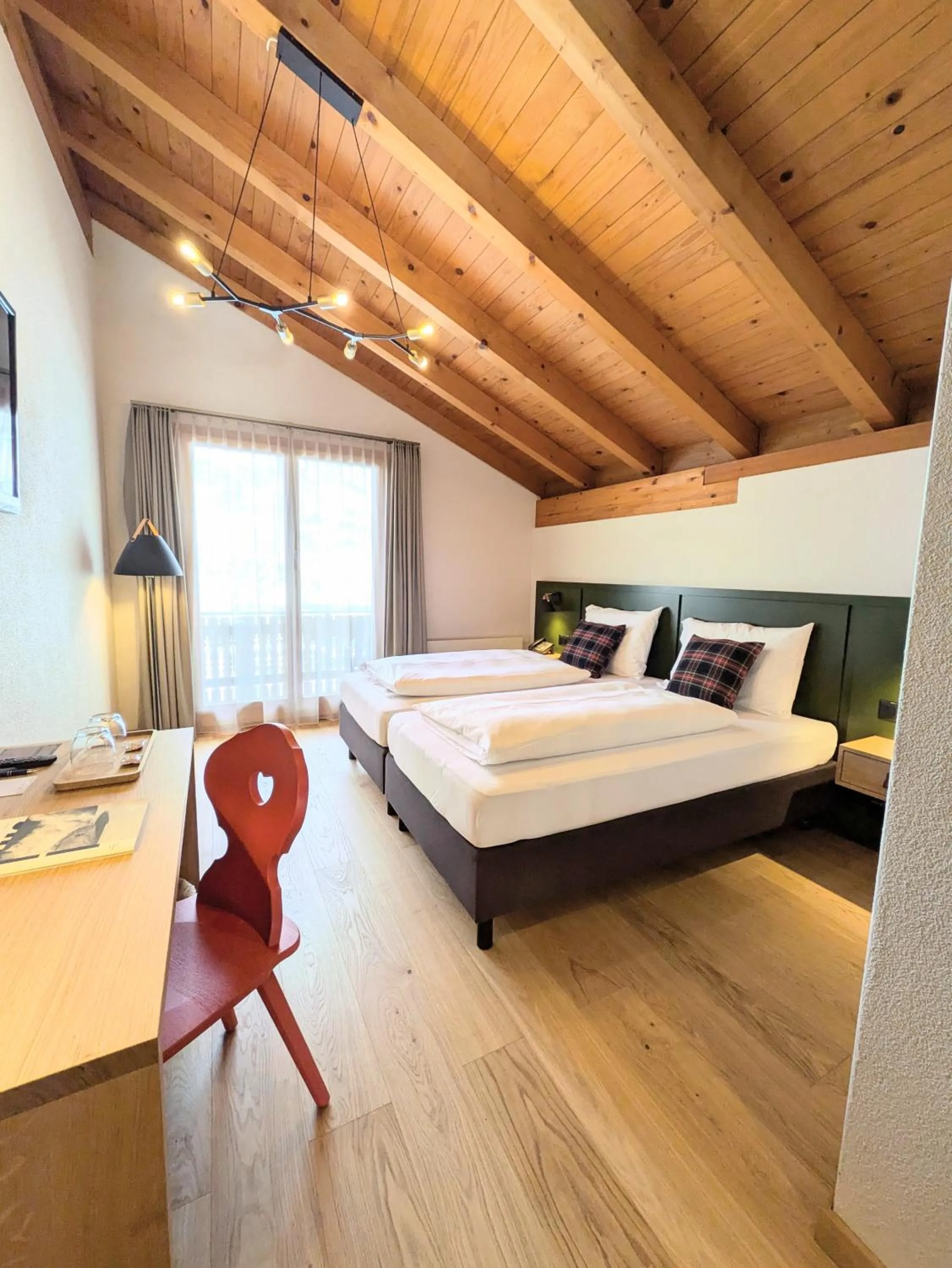 Photo of the whole room, Bed in Hotel Sonnwendhof Engelberg