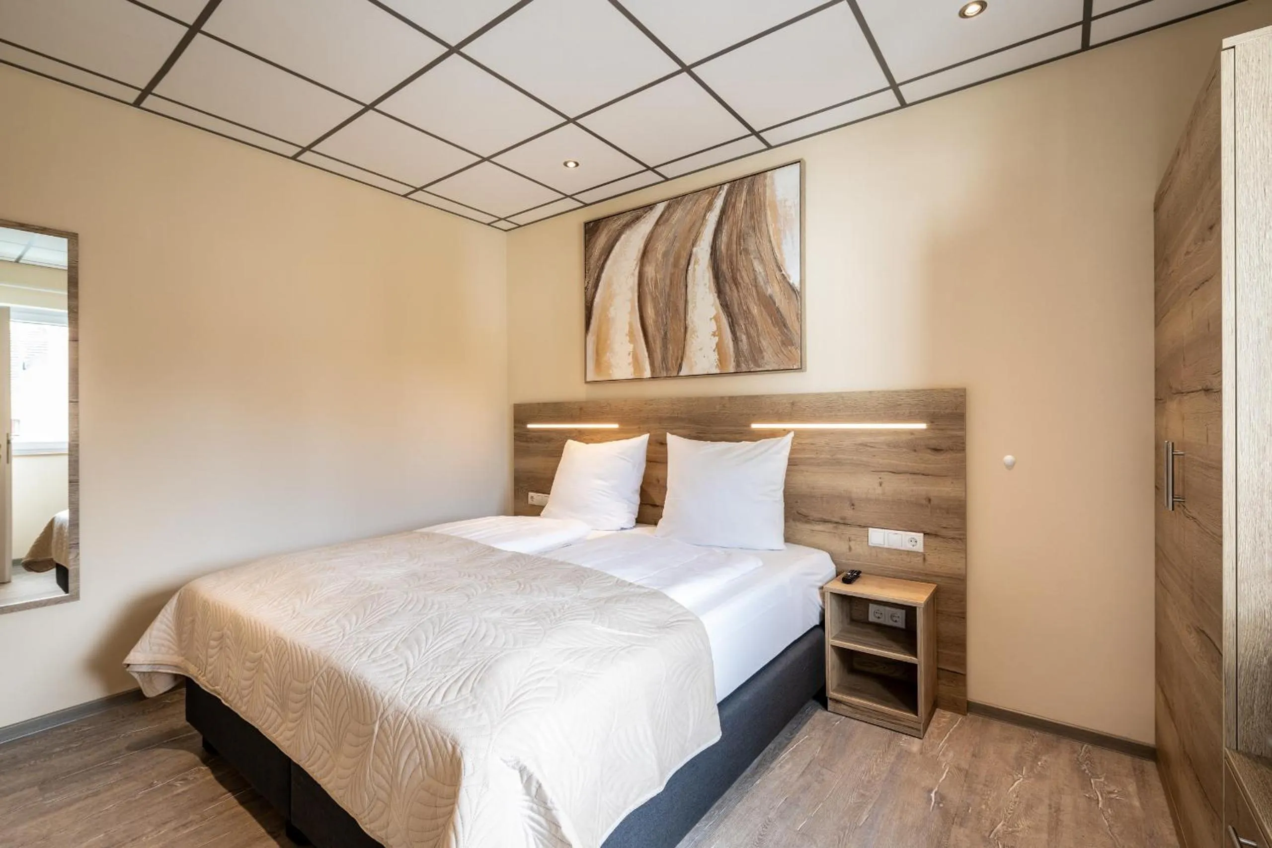 Bed in Apart Hotel Lang