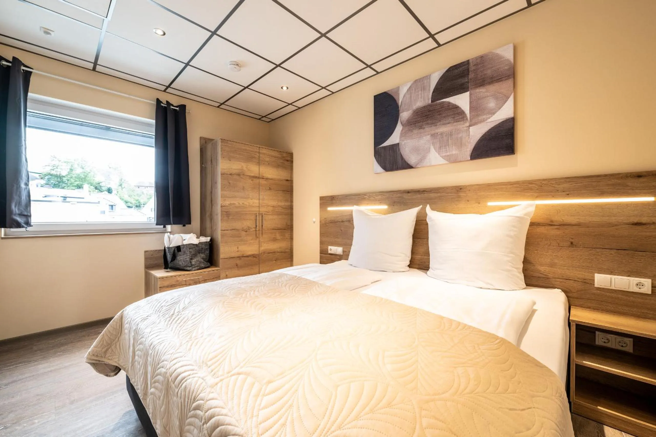 Bed in Apart Hotel Lang