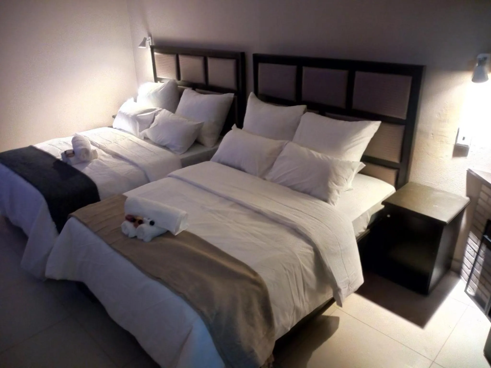 Bed in The Royal Prime Guest Lodge