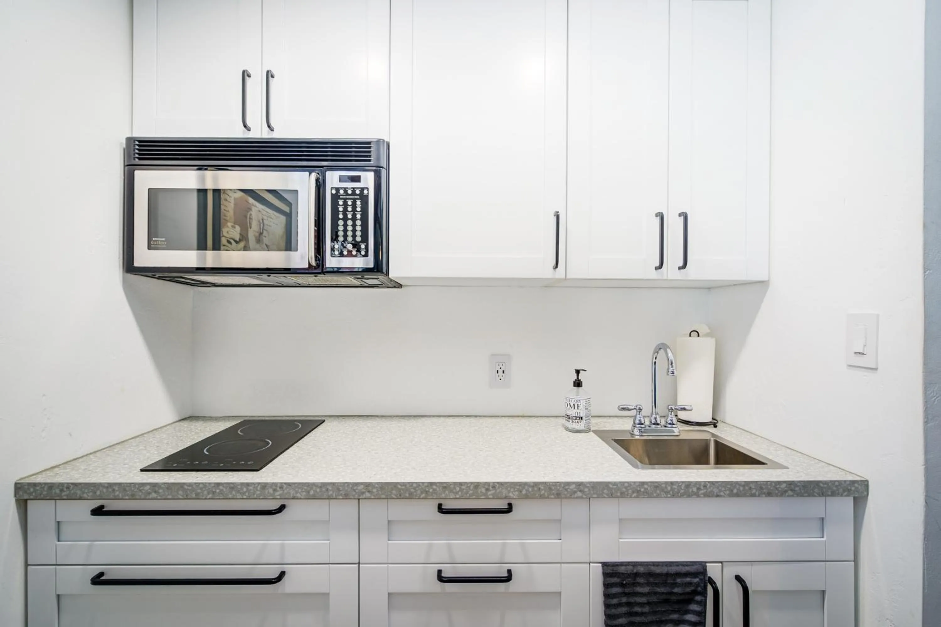 Kitchen or kitchenette in Little Paris by the ocean self check in