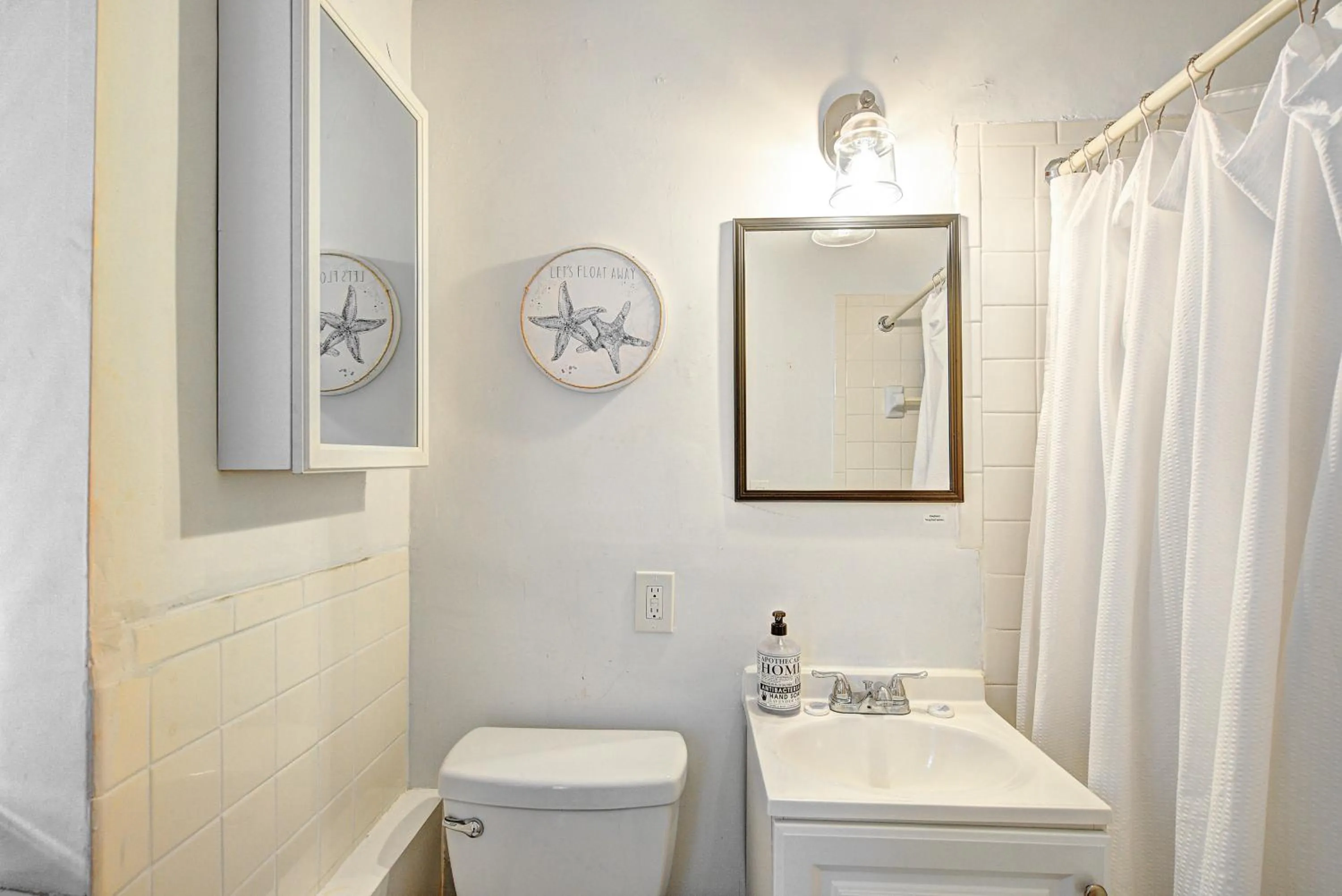 Bathroom in Little Paris by the ocean self check in