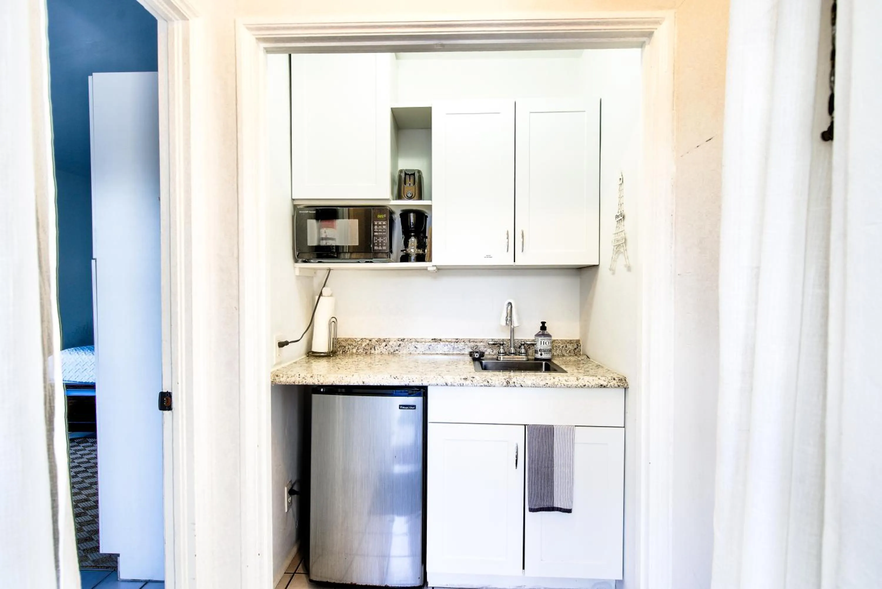 Kitchen or kitchenette in Little Paris by the ocean self check in