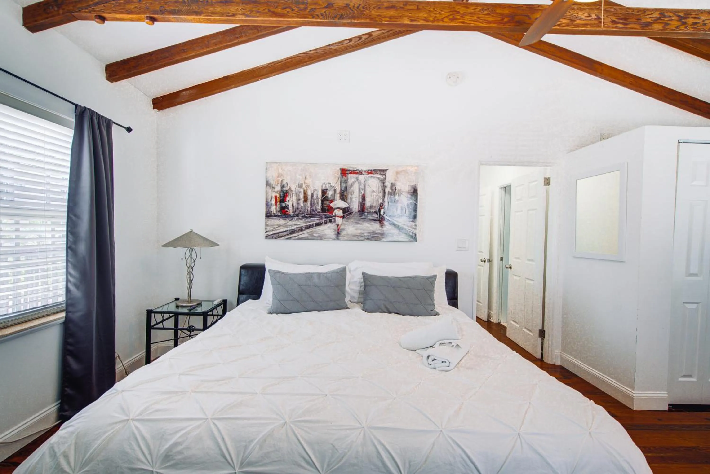 Bed in Little Paris by the ocean self check in