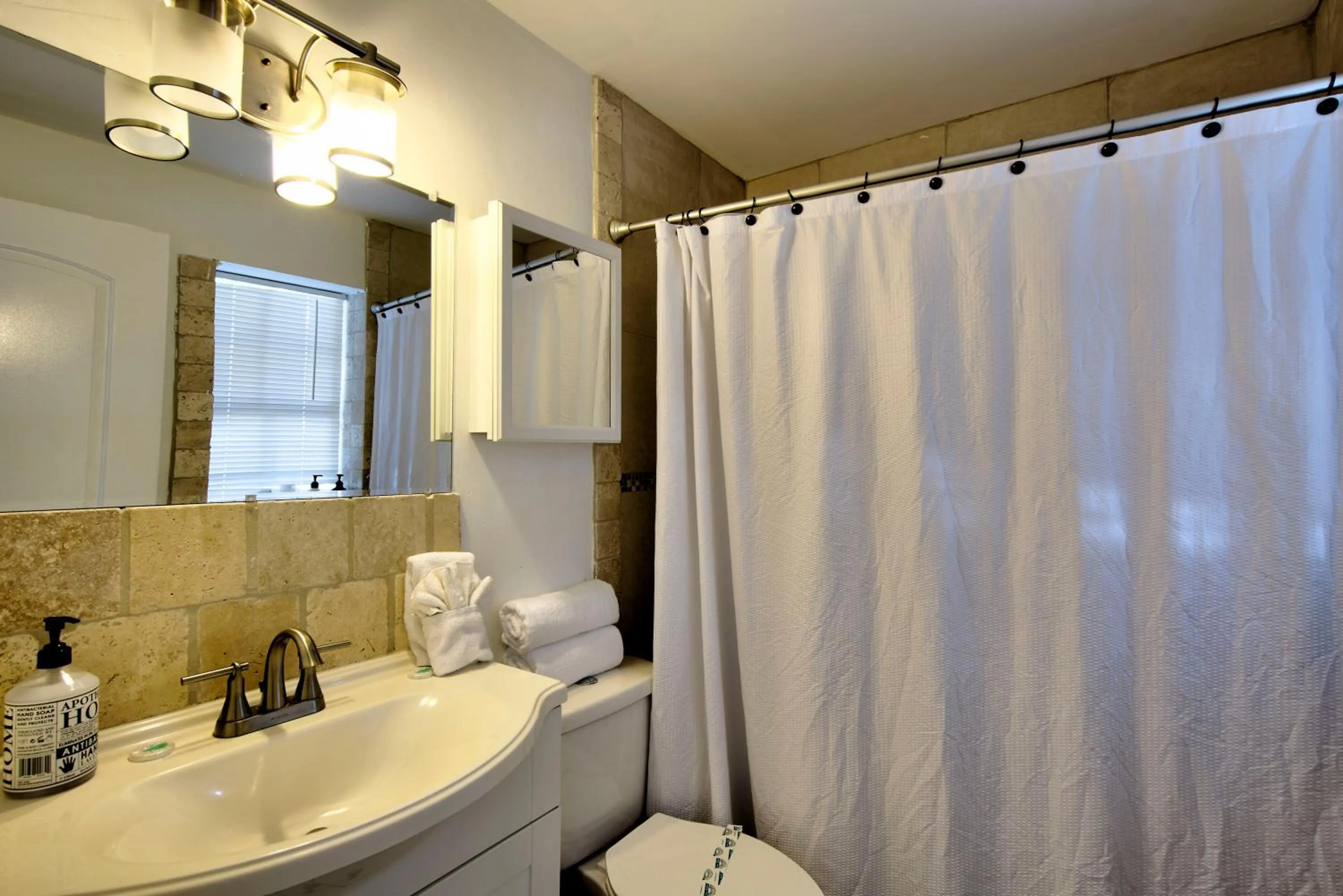 Bathroom in Little Paris by the ocean self check in