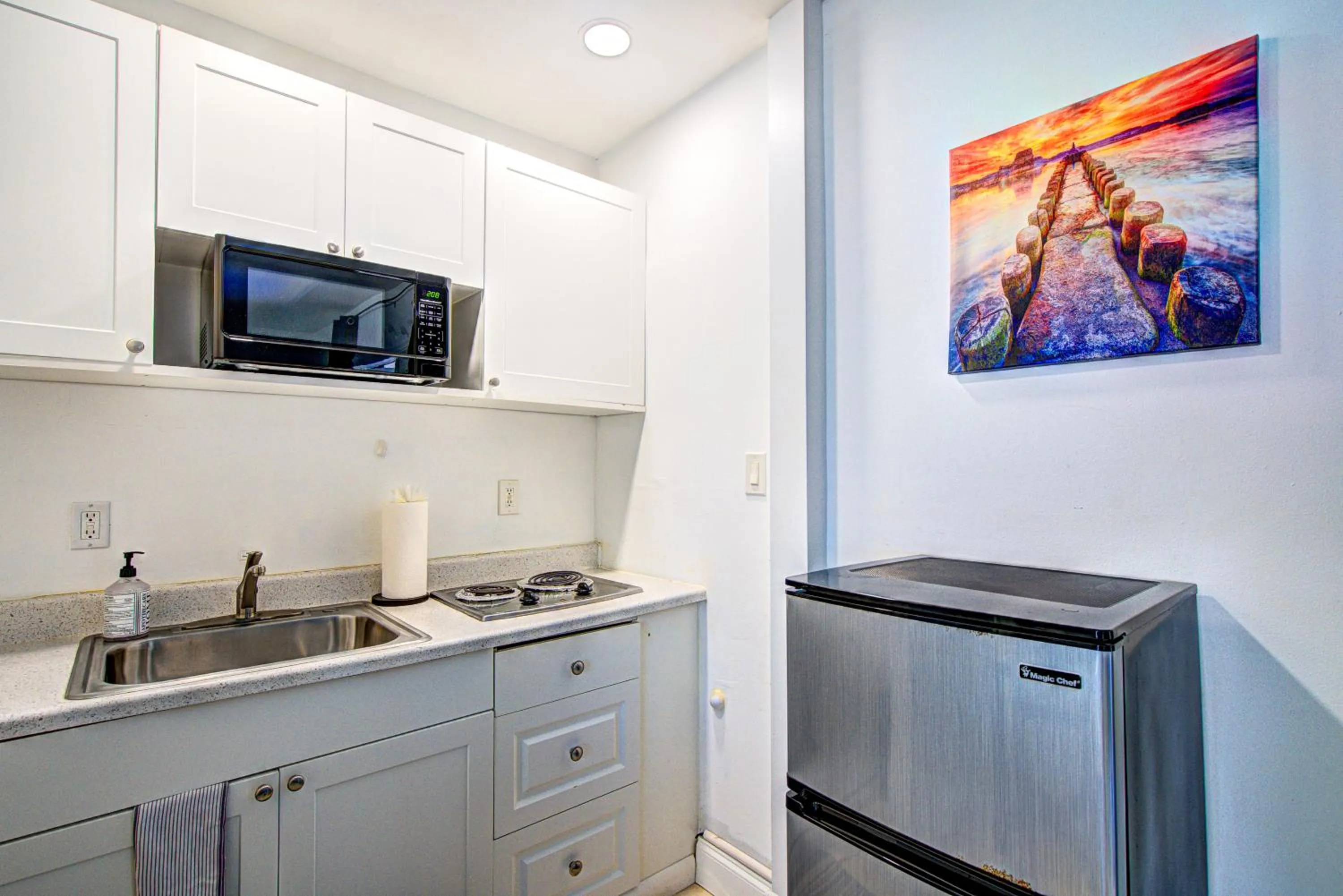 Kitchen or kitchenette in Little Paris by the ocean self check in