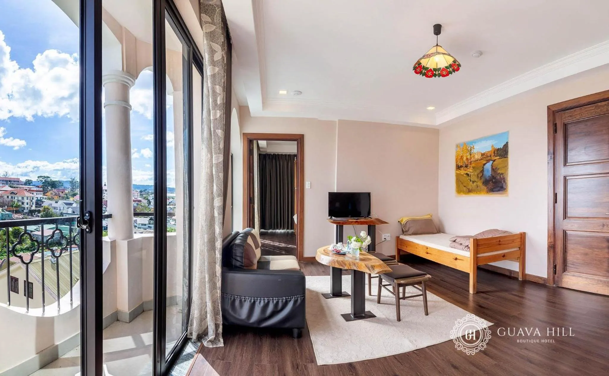 Communal lounge/ TV room in Guava Hill Boutique Hotel