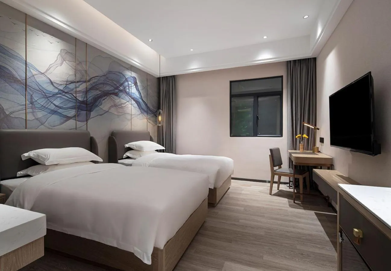 Bed in Paco Hotel Jinfeng Metro Guangzhou