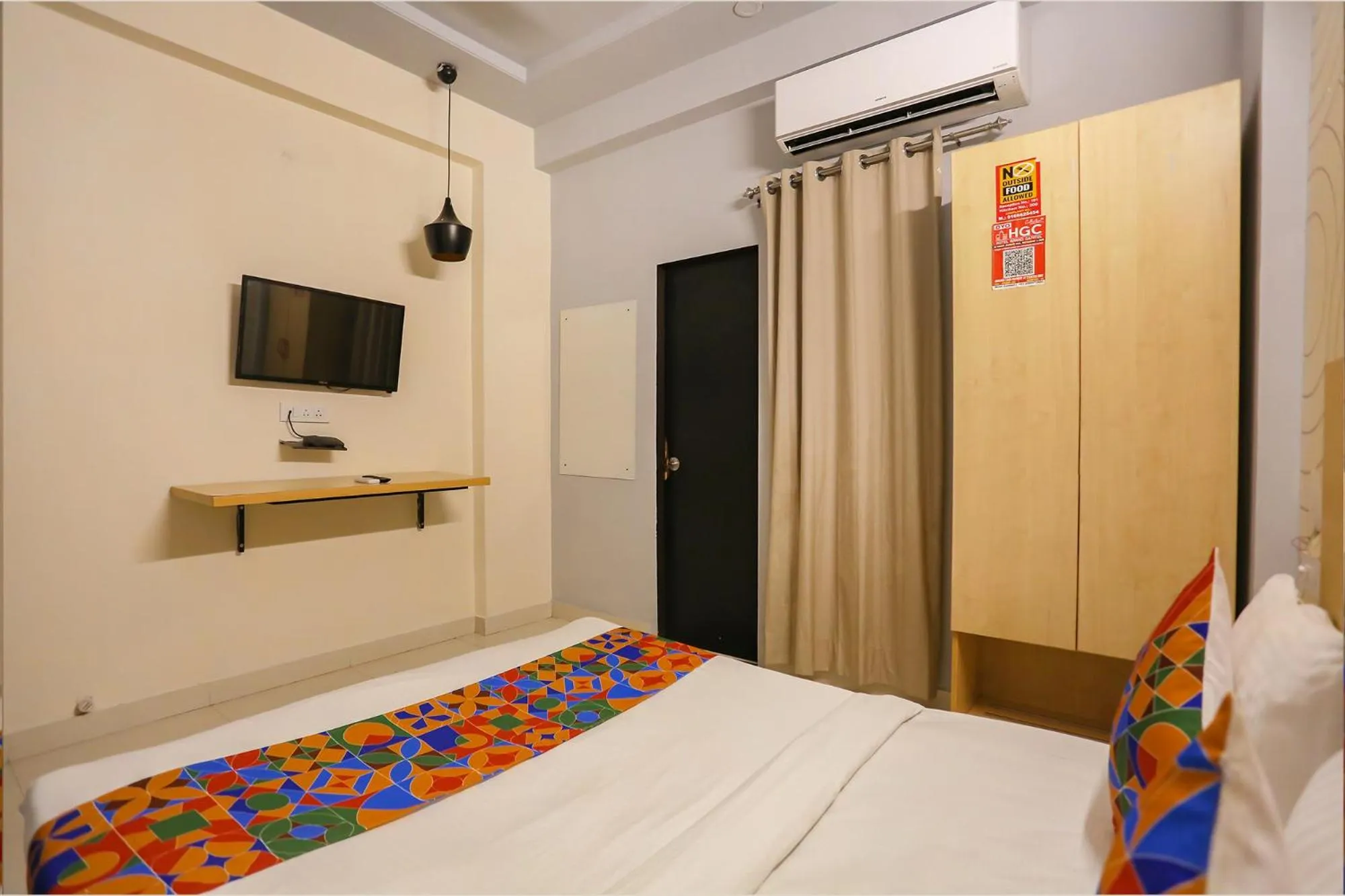 Bed in FabHotel Grand Capitol