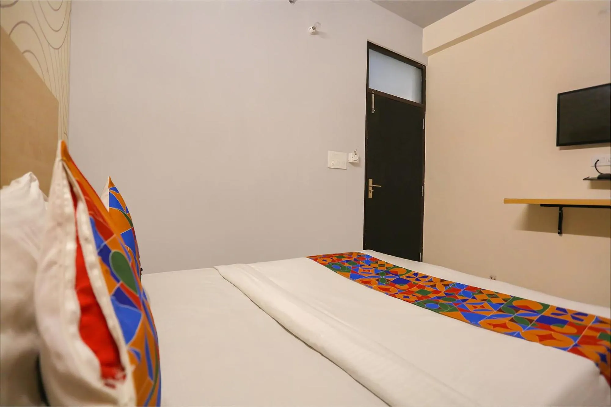 Bed in FabHotel Grand Capitol