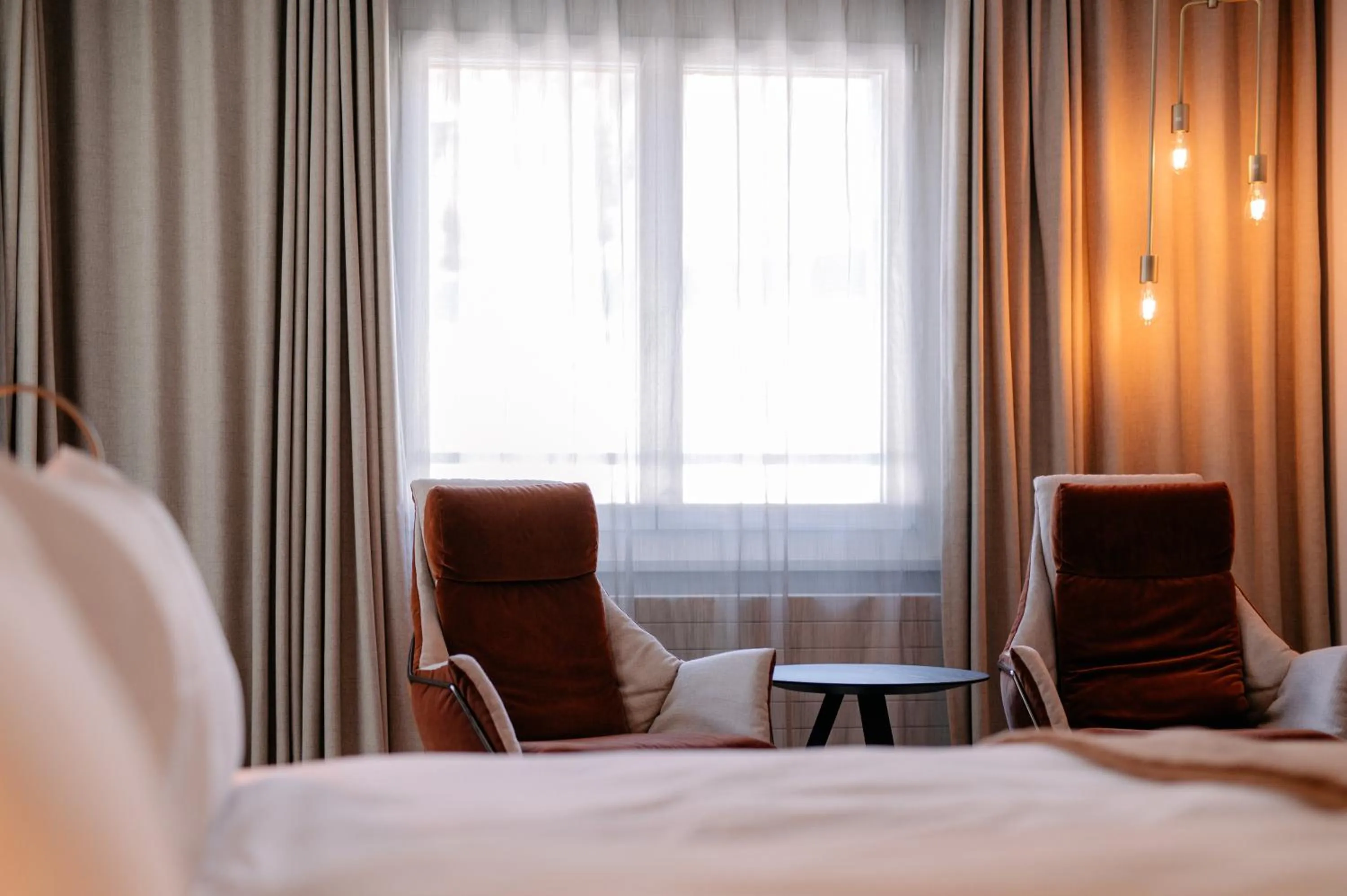 Photo of the whole room, Bed in Kongress Hotel Davos