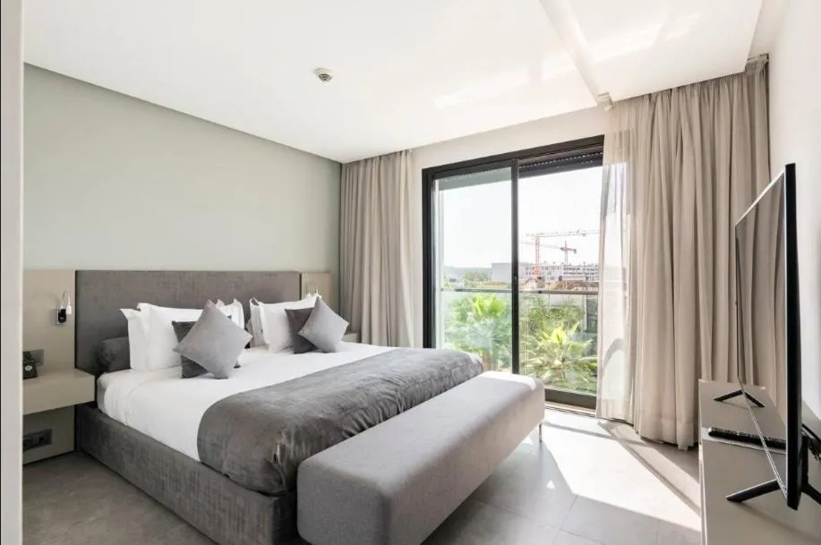 Bed in Makass Appart Hotel