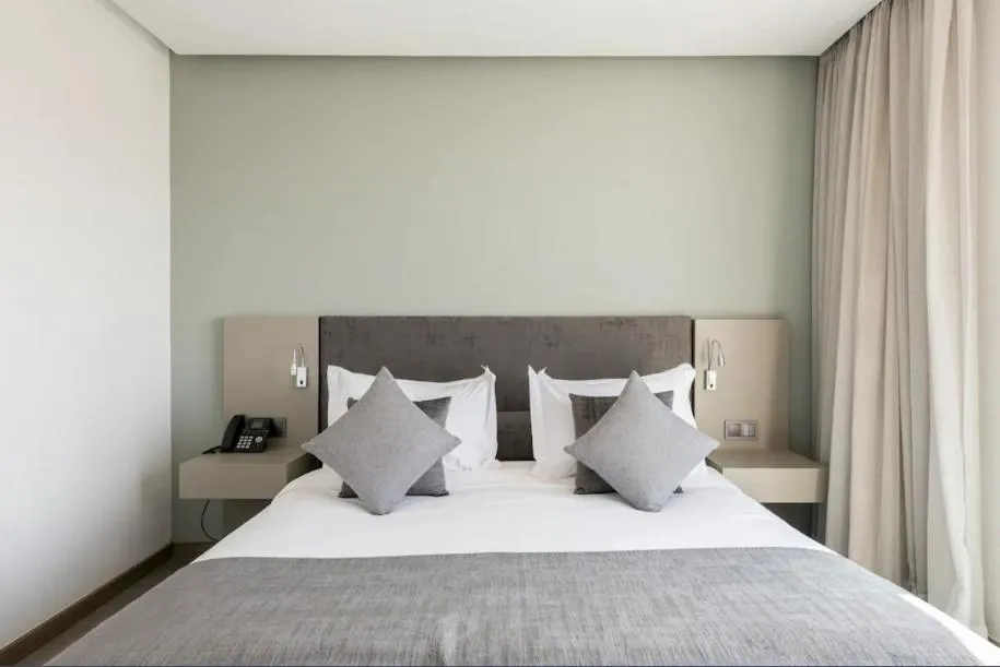 Bed in Makass Appart Hotel