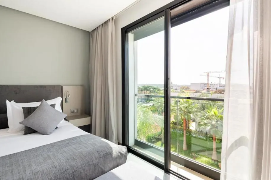 Bed in Makass Appart Hotel