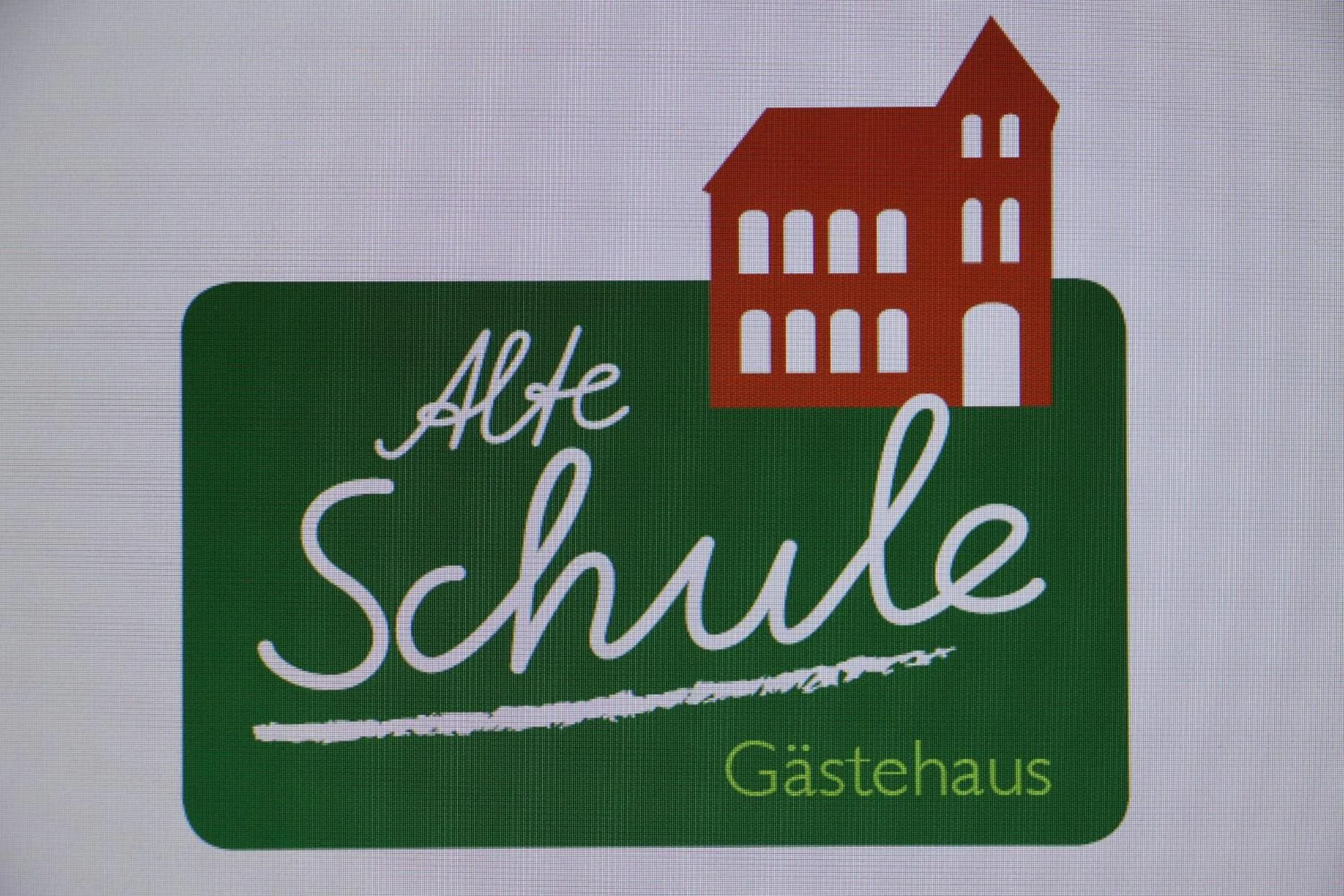Property logo or sign in Gästehaus Alte Schule