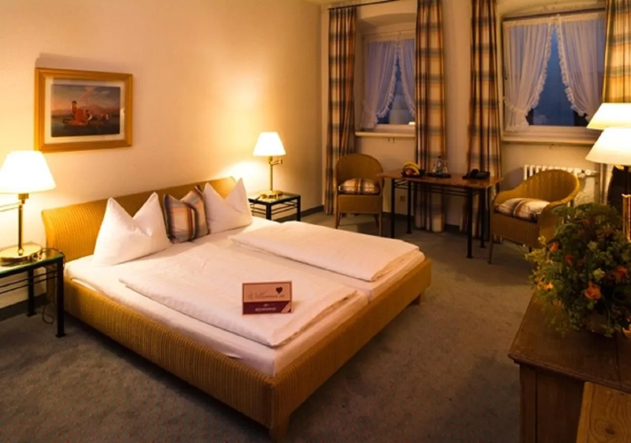 Bed in Posthotel Kolberbräu