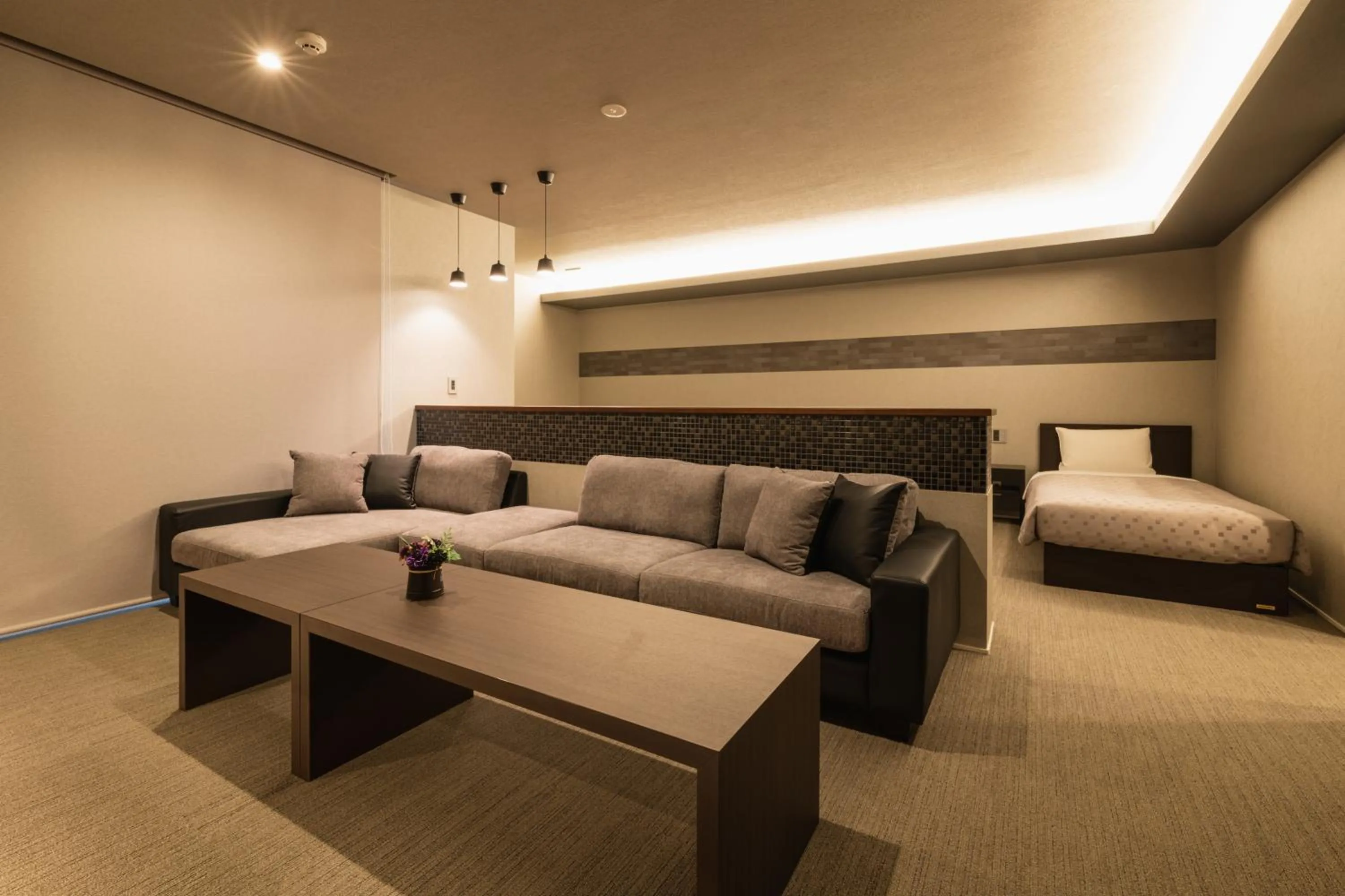 Seating area, Bed in GRAND BASE Hakata Station