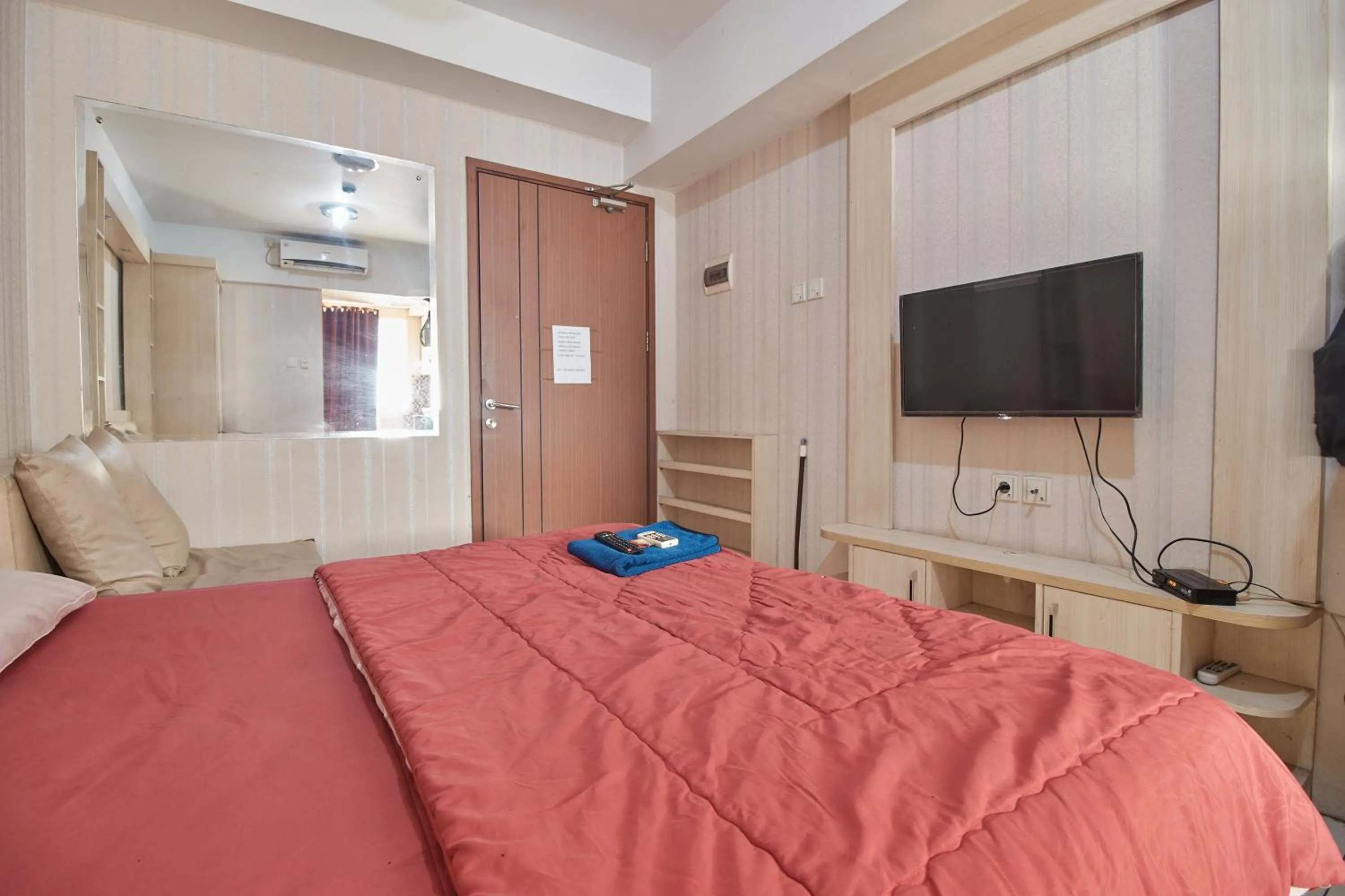 Bed in Apartment Green Lake View Ciputat by Celebrity Room