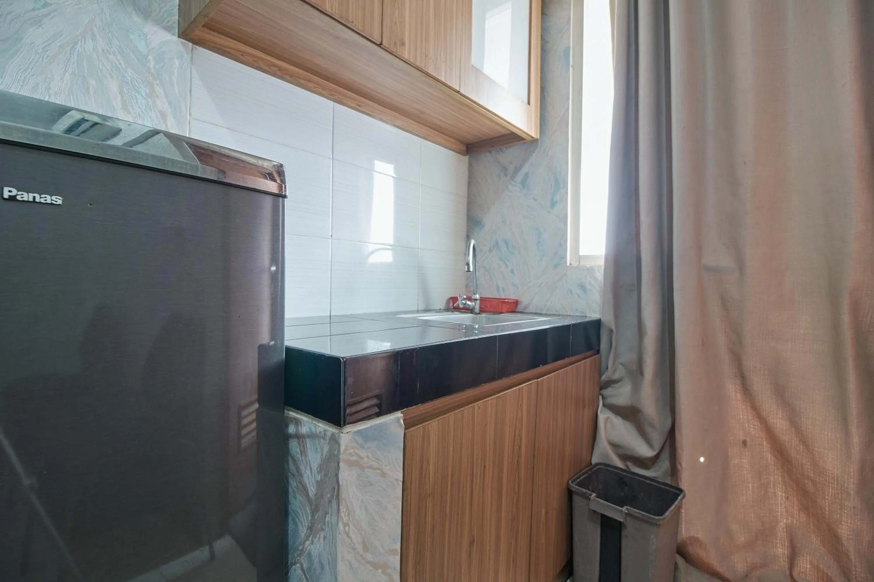 Kitchen or kitchenette in Apartment Green Lake View Ciputat by Celebrity Room