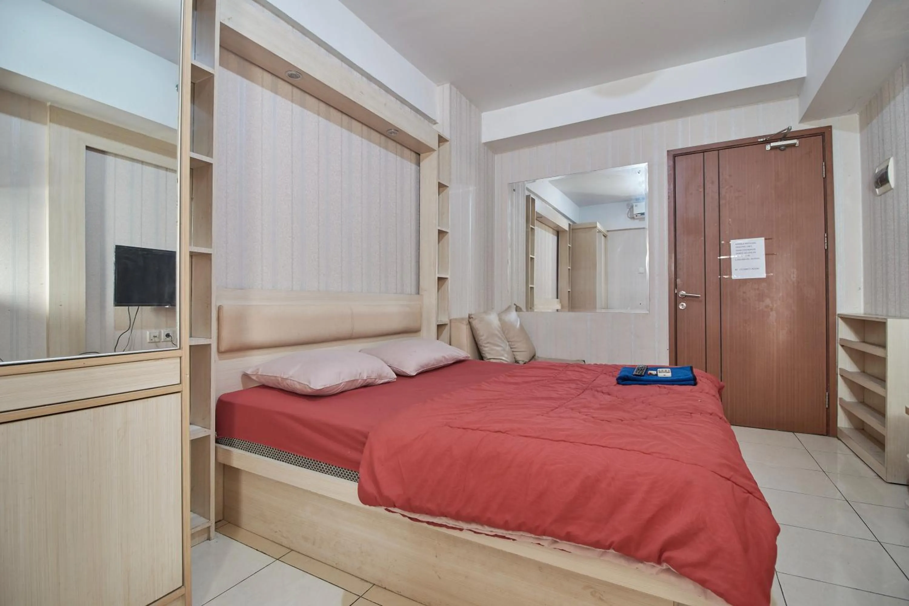 Bed in Apartment Green Lake View Ciputat by Celebrity Room