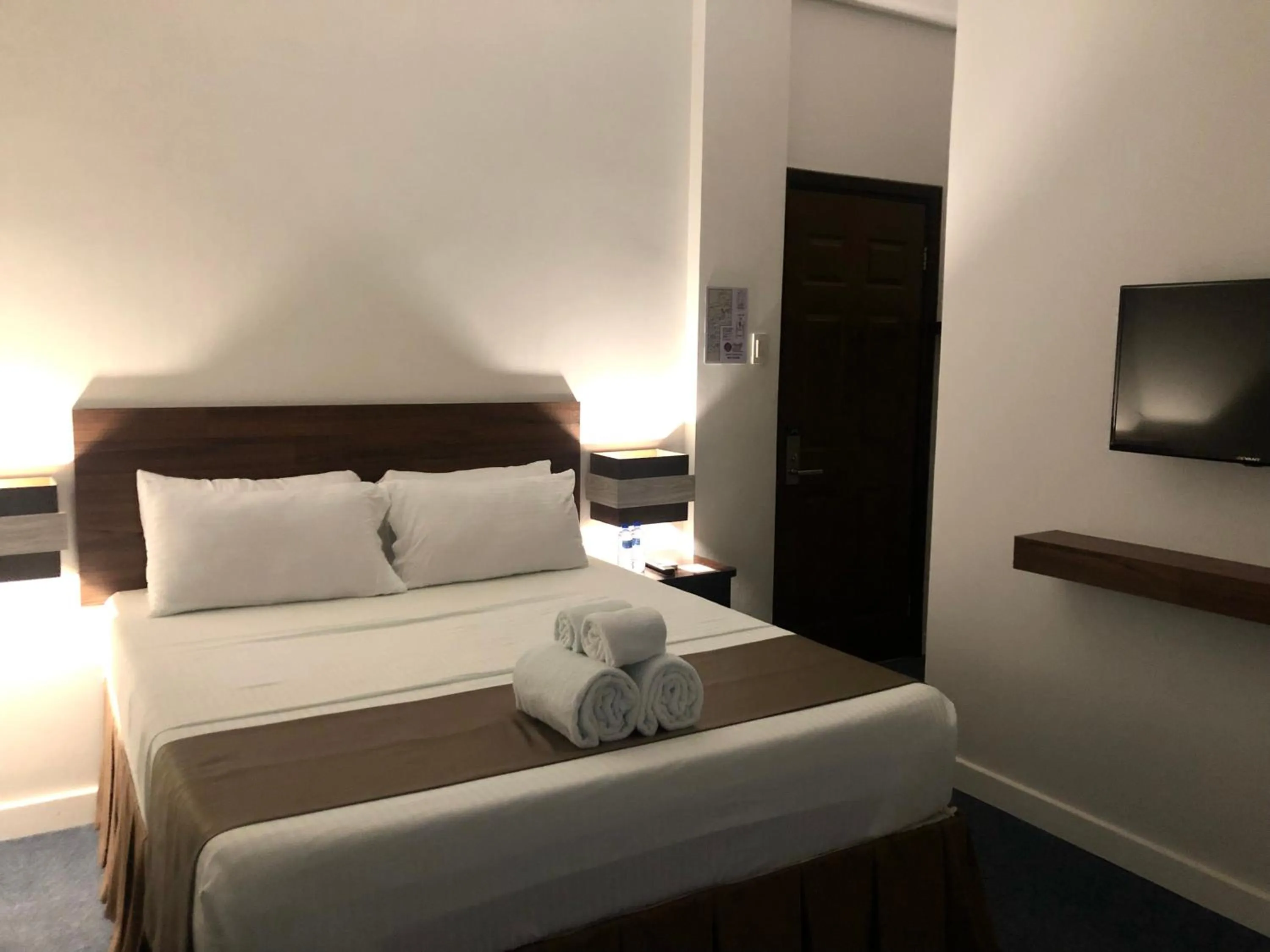 Bed in Seacliff Suites Hotel and Resort