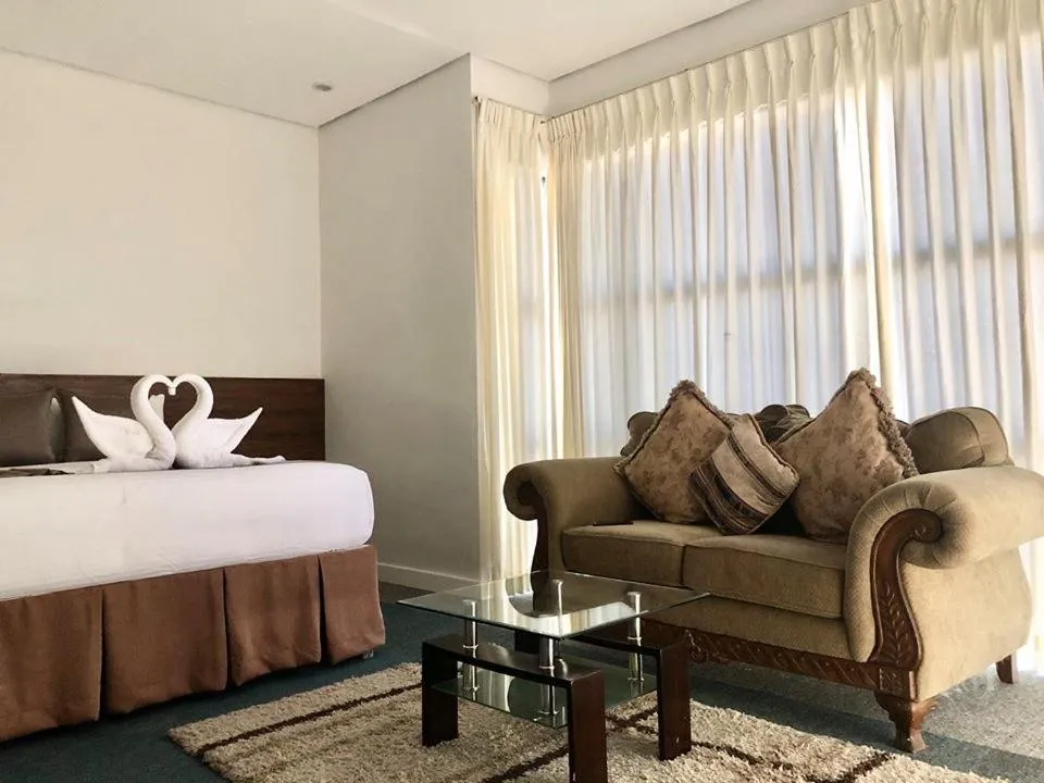 Bed in Seacliff Suites Hotel and Resort