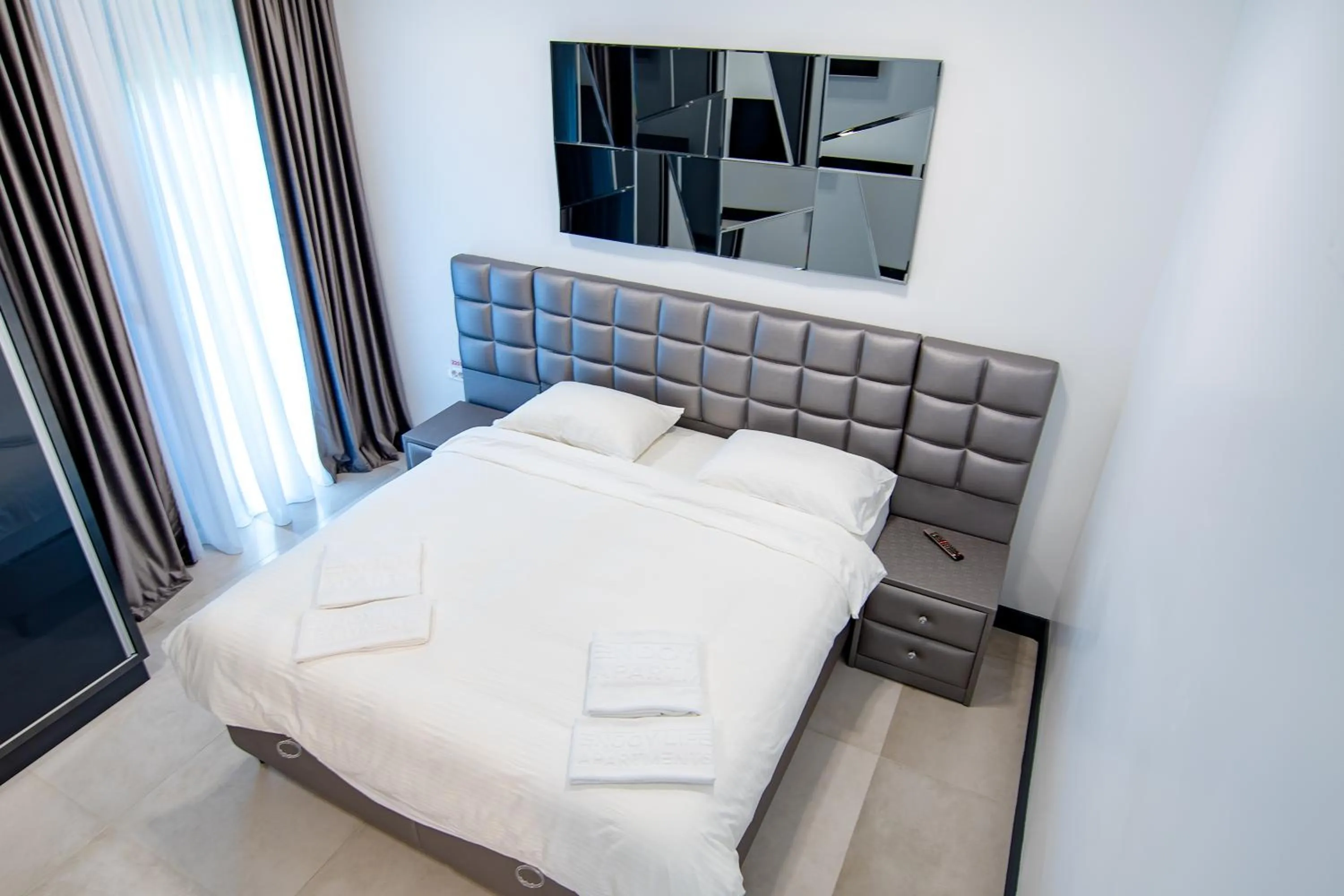 Bed in Enjoy Life Apartments