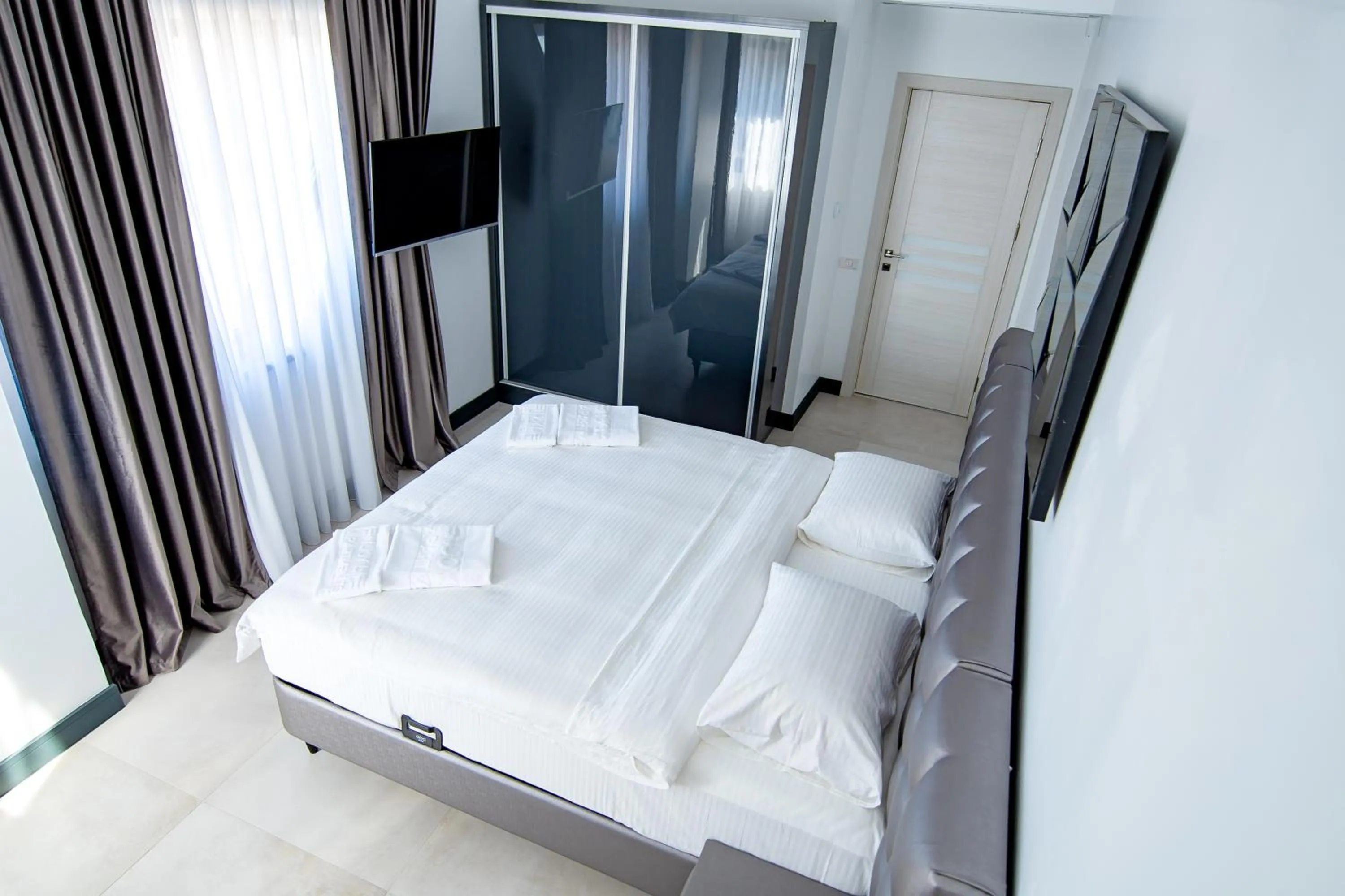 Bed in Enjoy Life Apartments