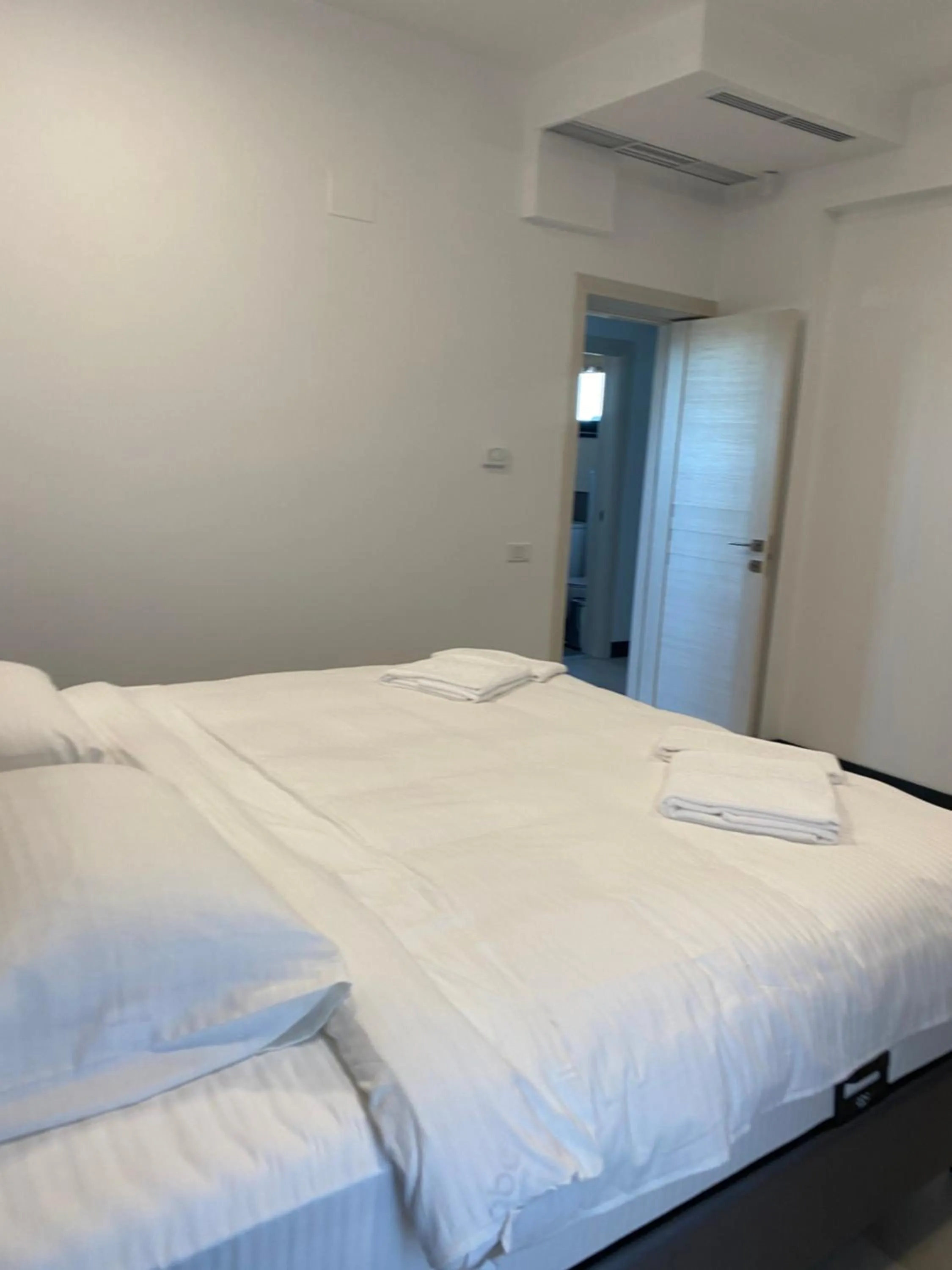 Bed in Enjoy Life Apartments