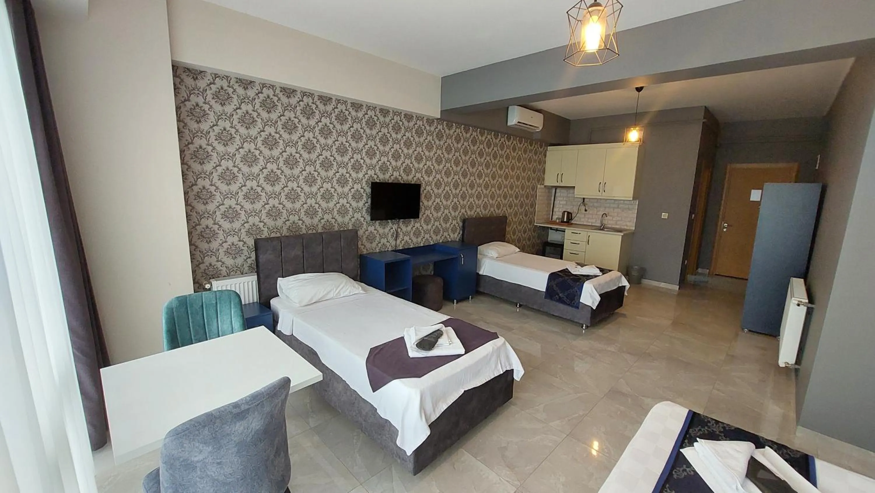 Bed in Mini Suite Otel