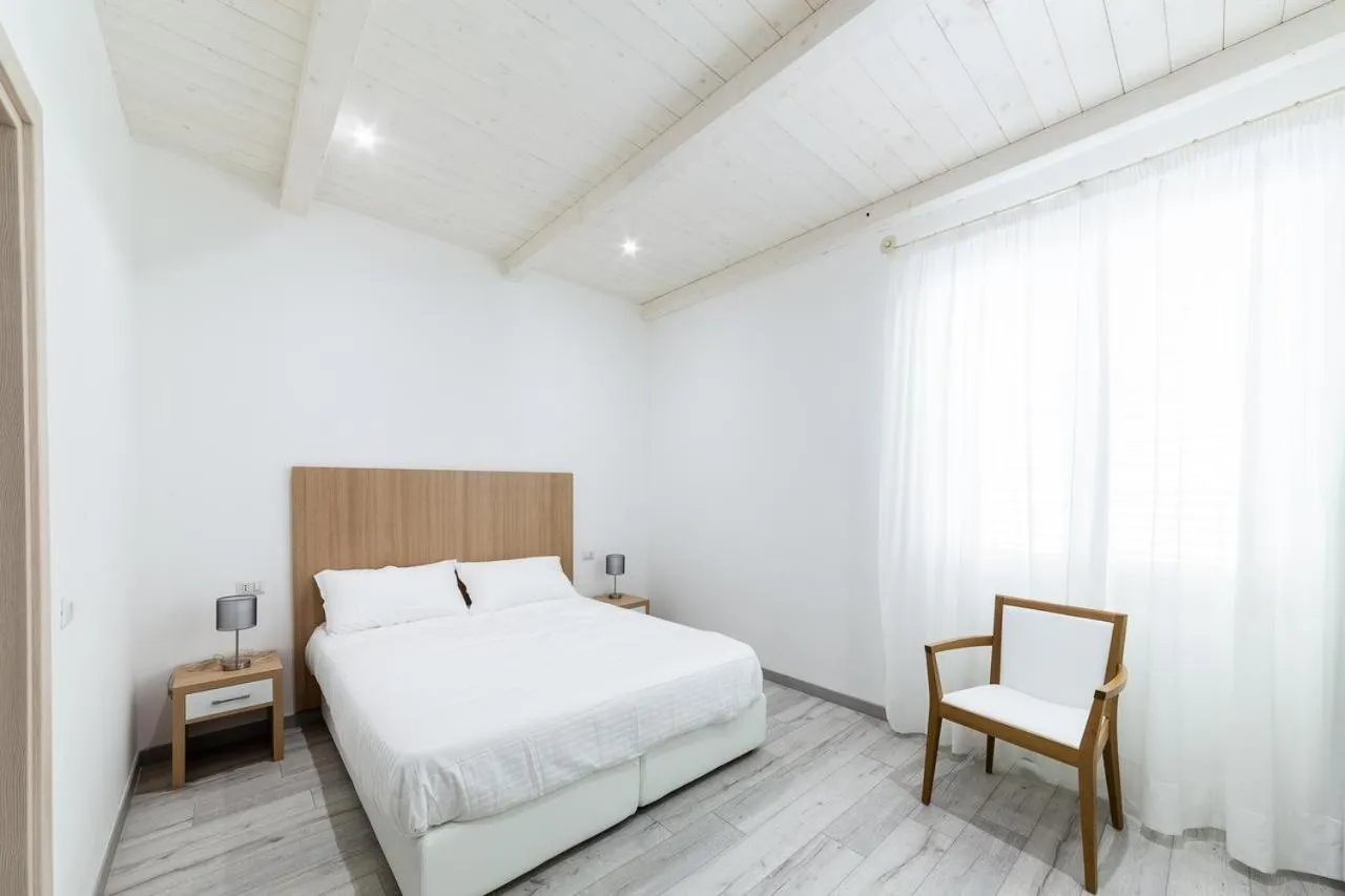 Property building, Bed in La Promenade Rooms & Suites