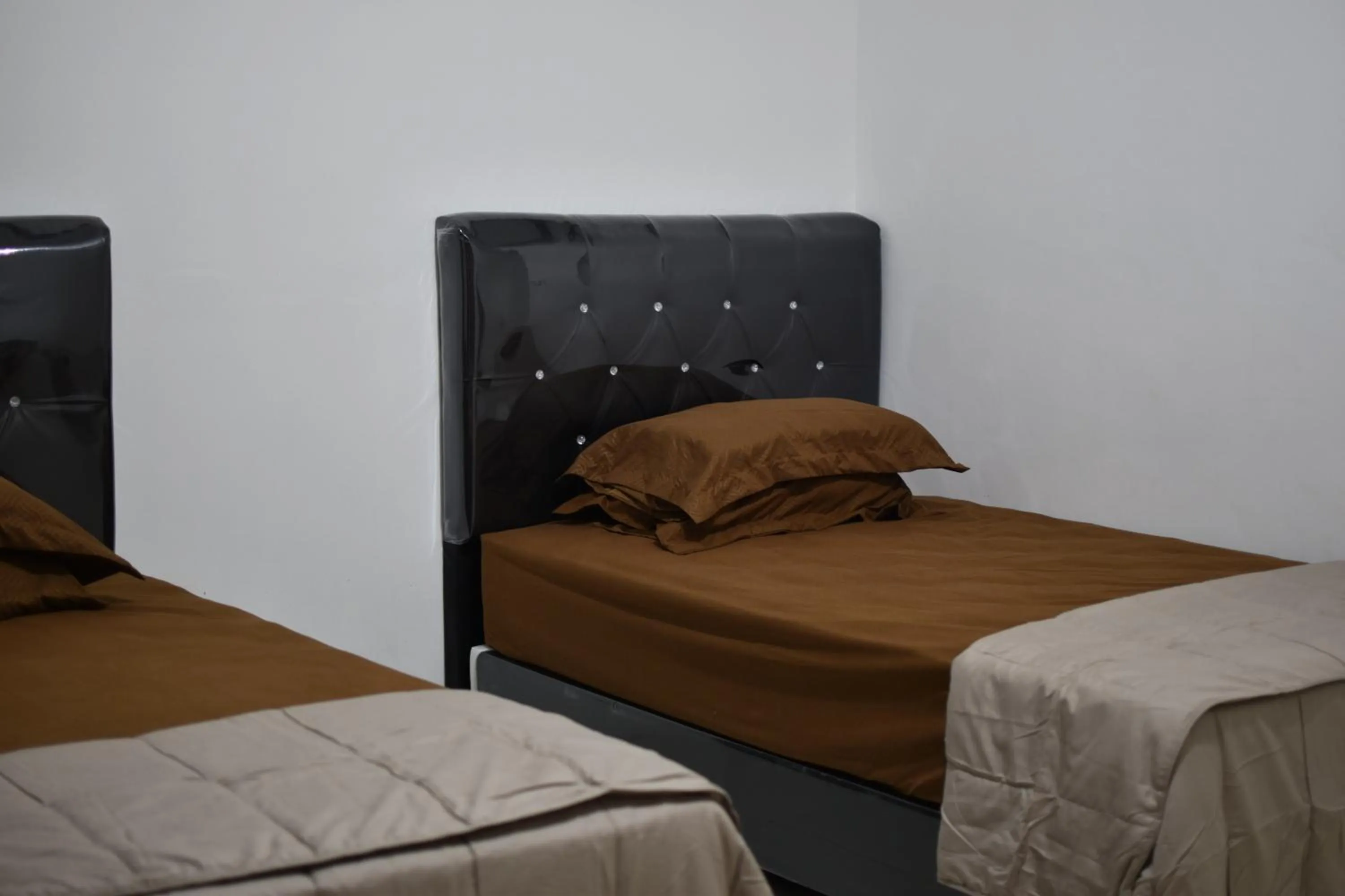 Bed in Penginapan Erbysa