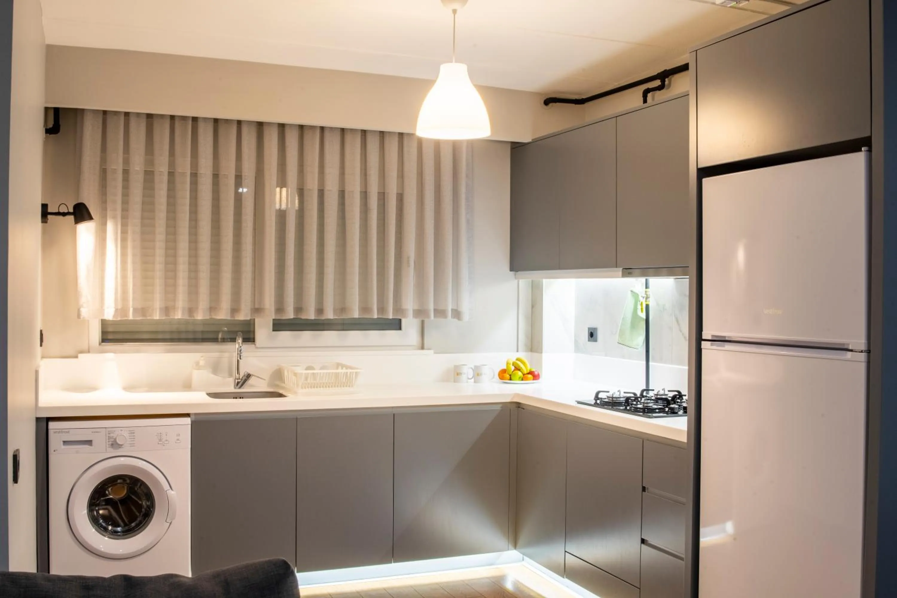 Kitchen or kitchenette in Stile Suite Family Hotel