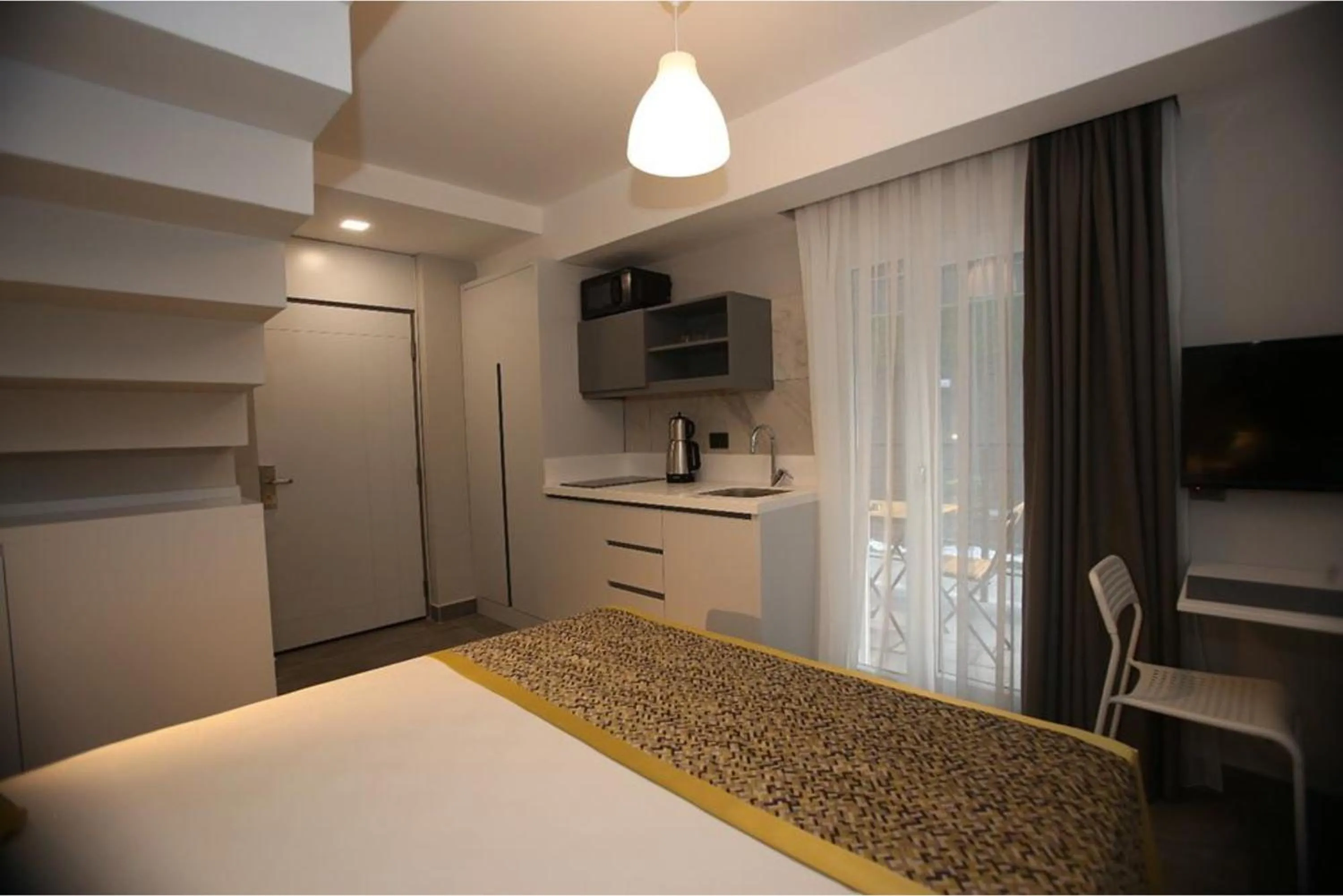 Bed in Stile Suite Family Hotel