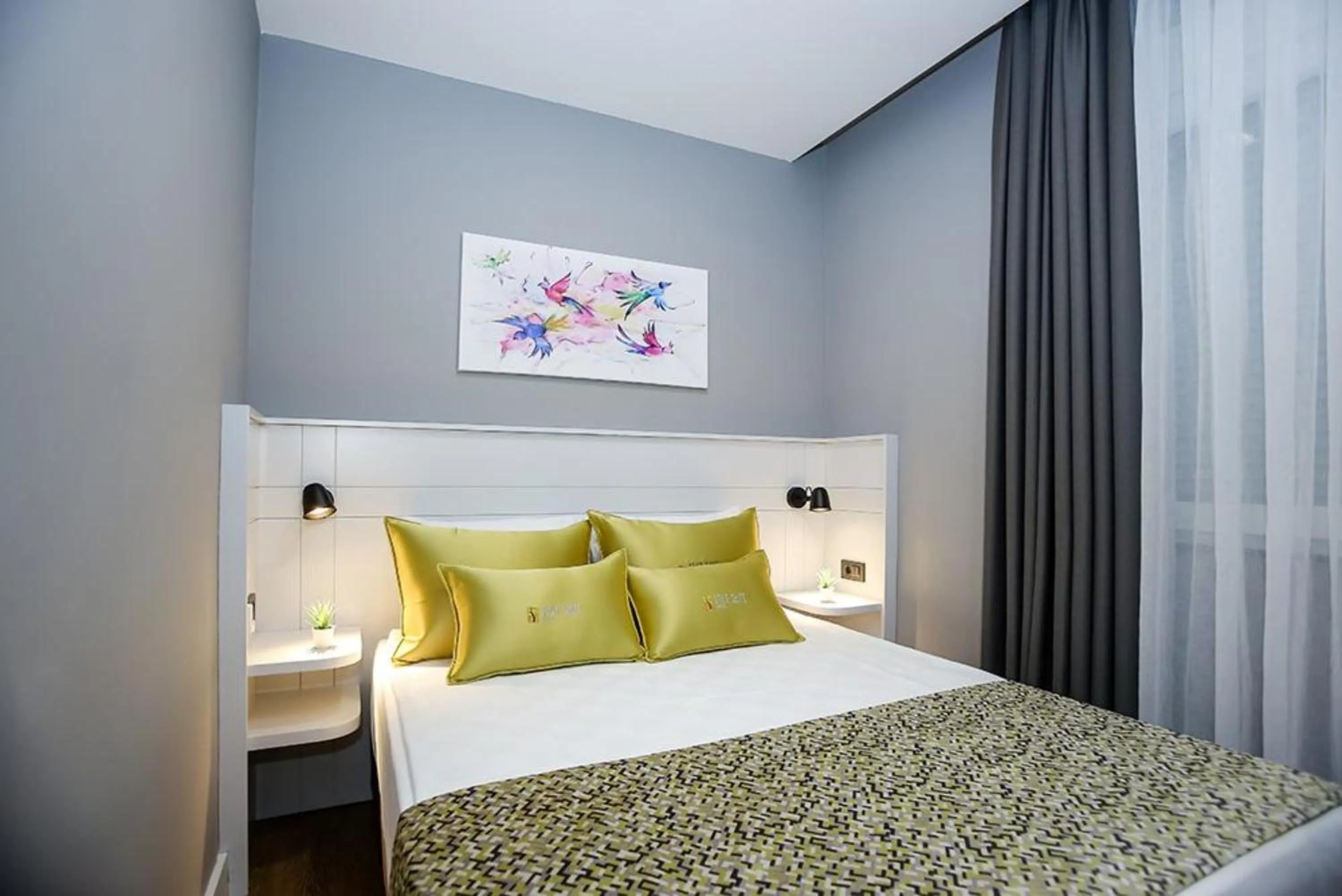 Bed in Stile Suite Family Hotel