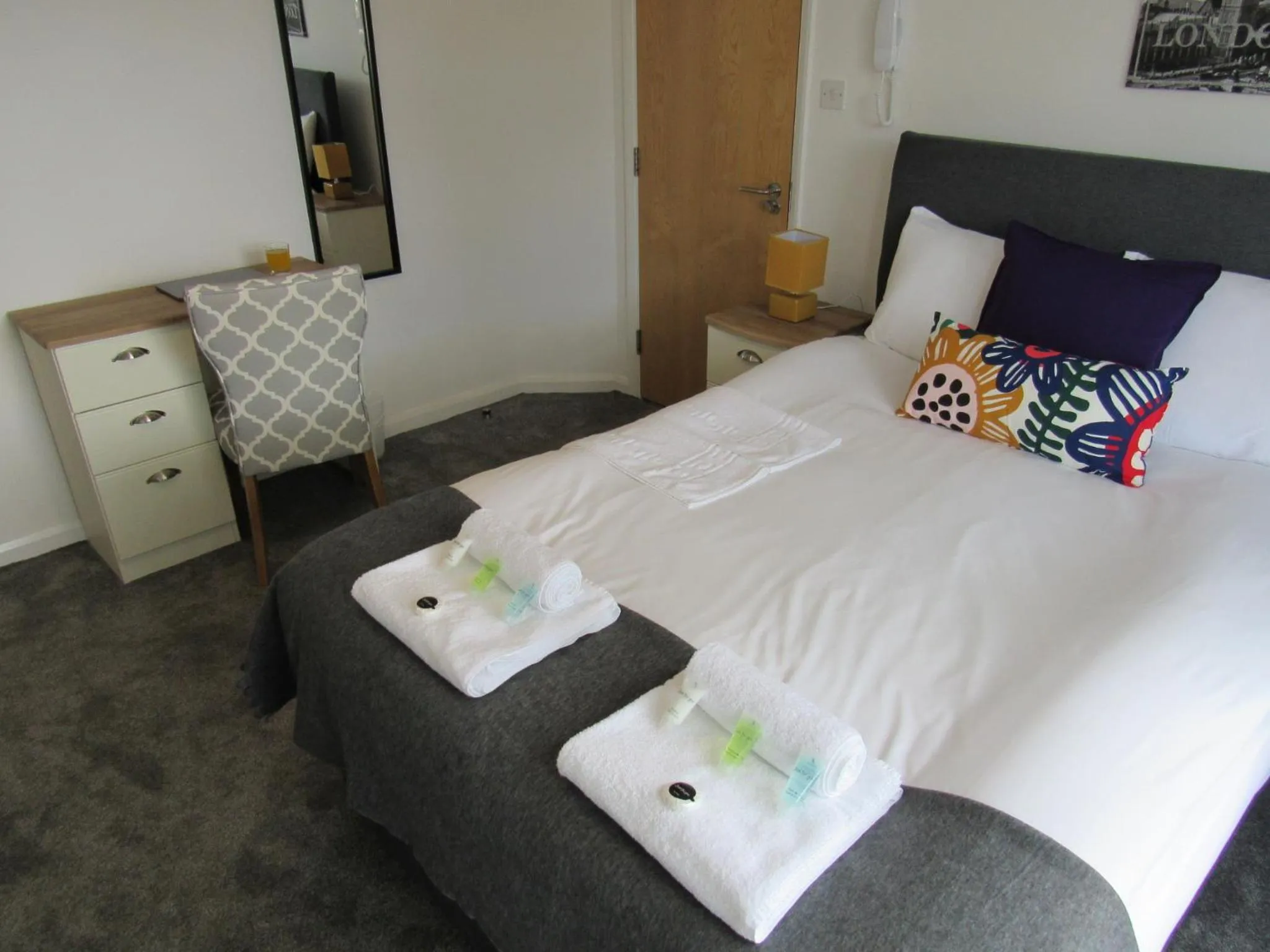 Bed in The Cambridge Suites - Tas Accommodations