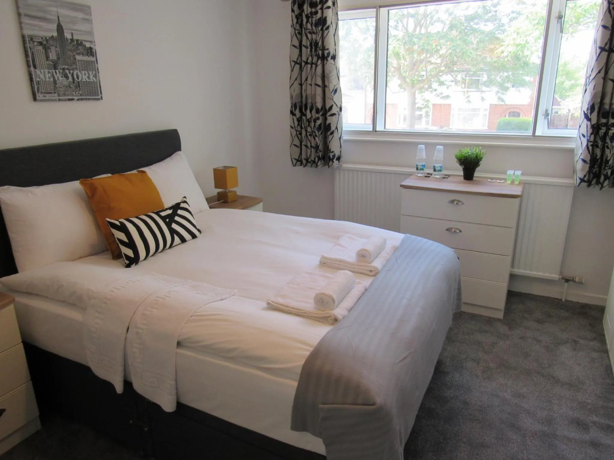 Bed in The Cambridge Suites - Tas Accommodations