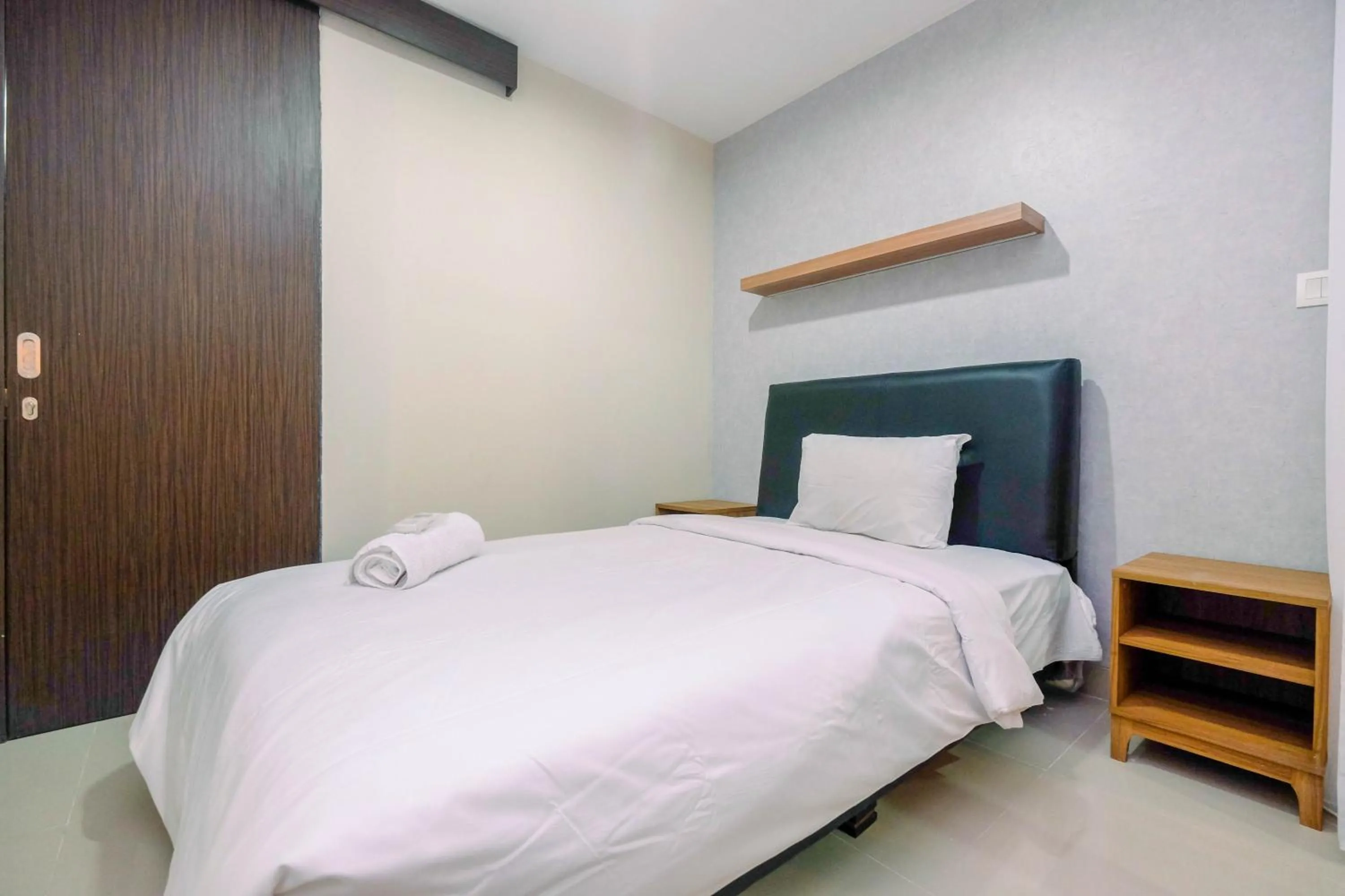 Bed in Cozy 2BR Apartment Nine Residence with City View By Travelio